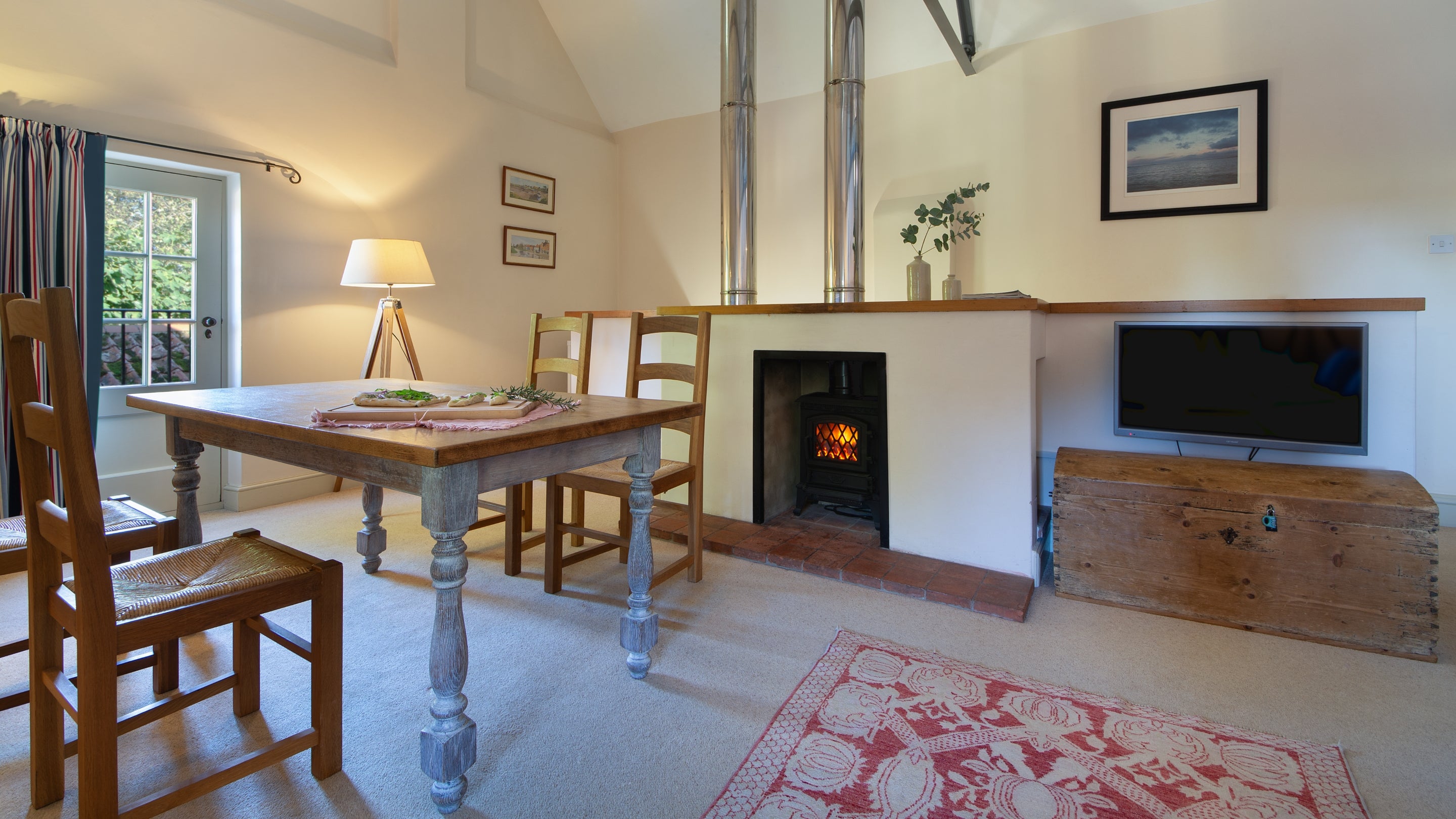 The dining area in the open-plan kitchen, dining and sitting room at Watermill Apartment, Norfolk