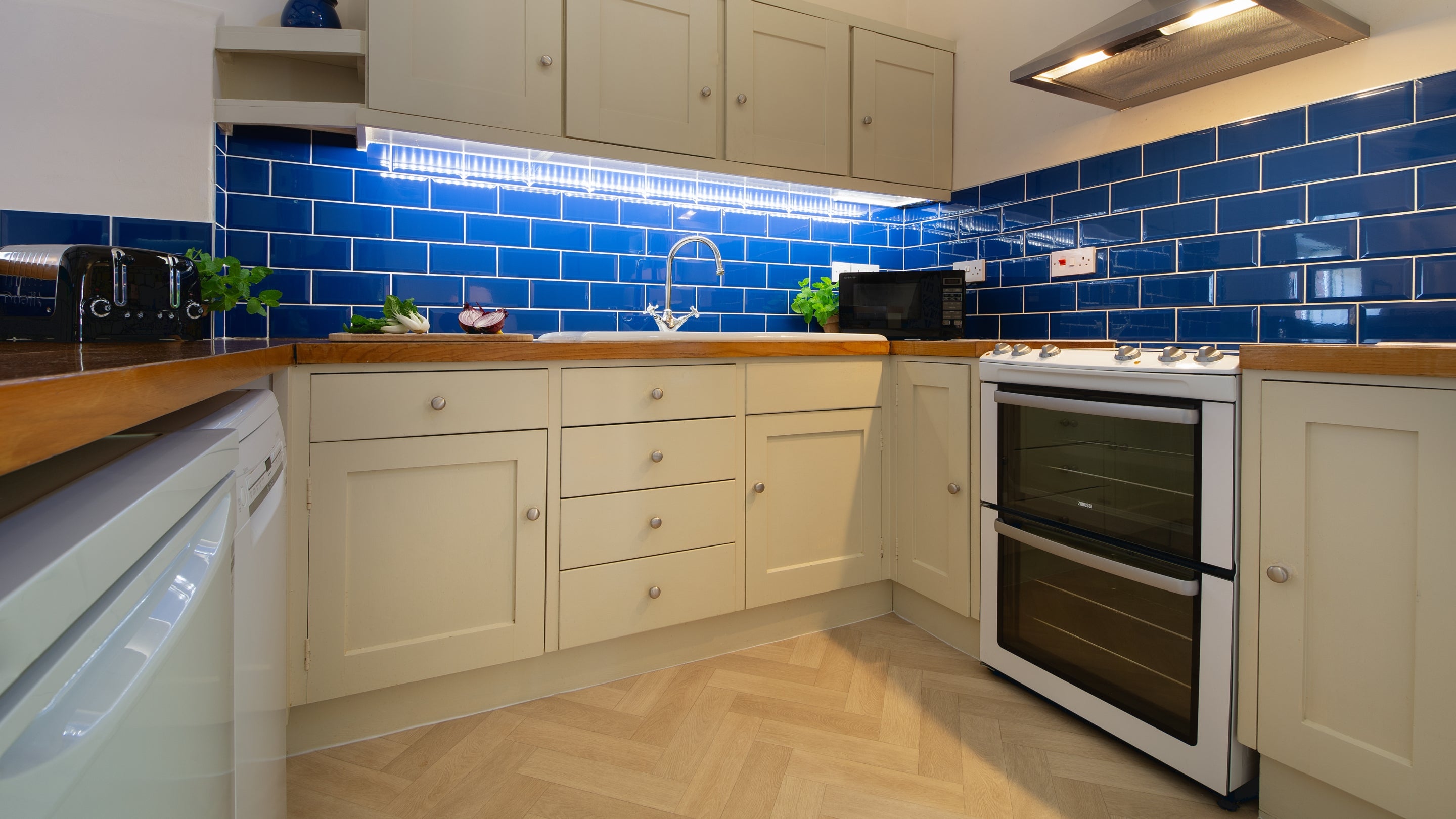 The ktichen area in the open-plan kitchen, dining and sitting room at Watermill Apartment, Norfolk