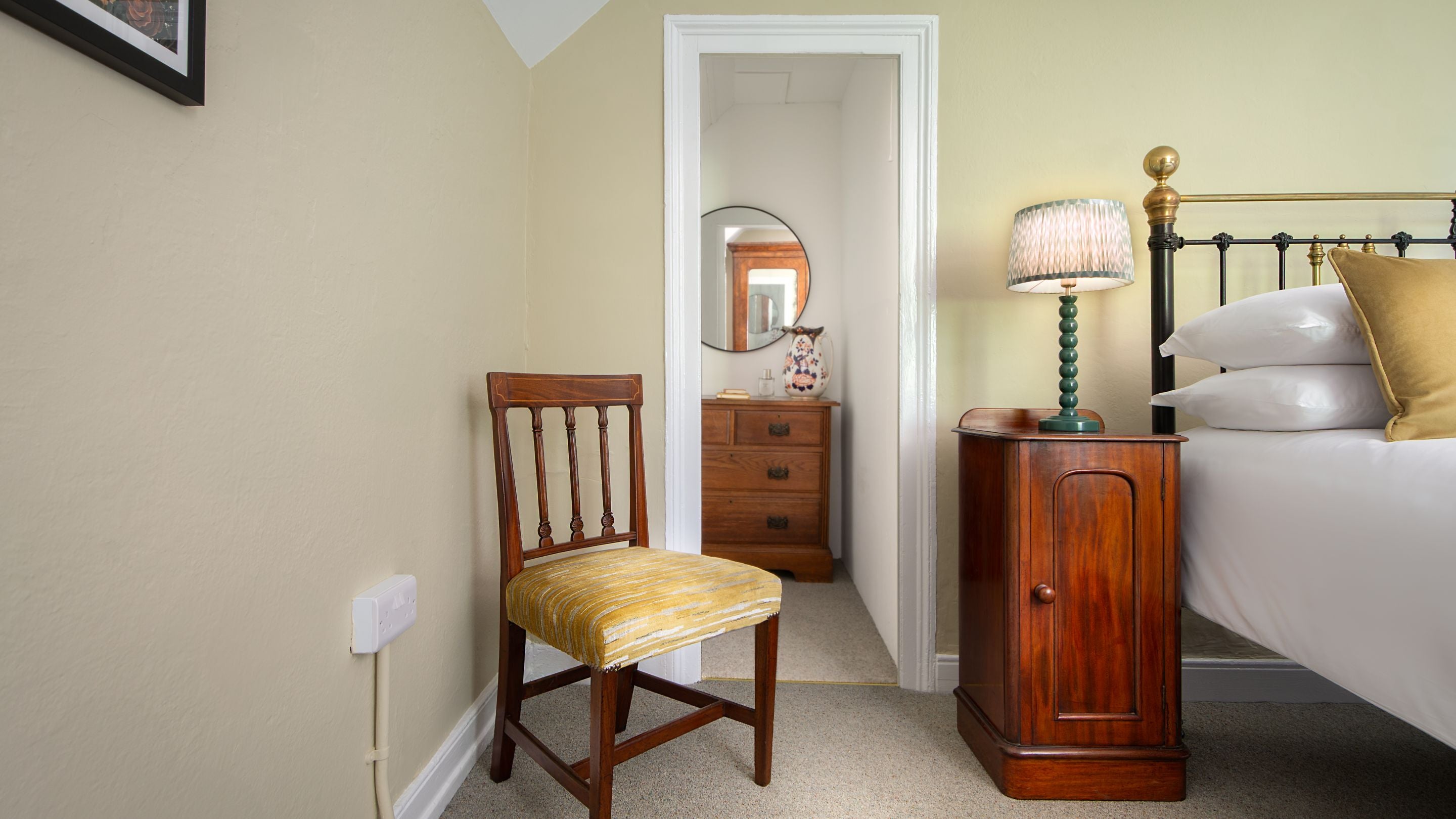 The doorway through to the dressing area in the king-size bedroom at Castle Ward Gamekeeper's Cottage, County Down