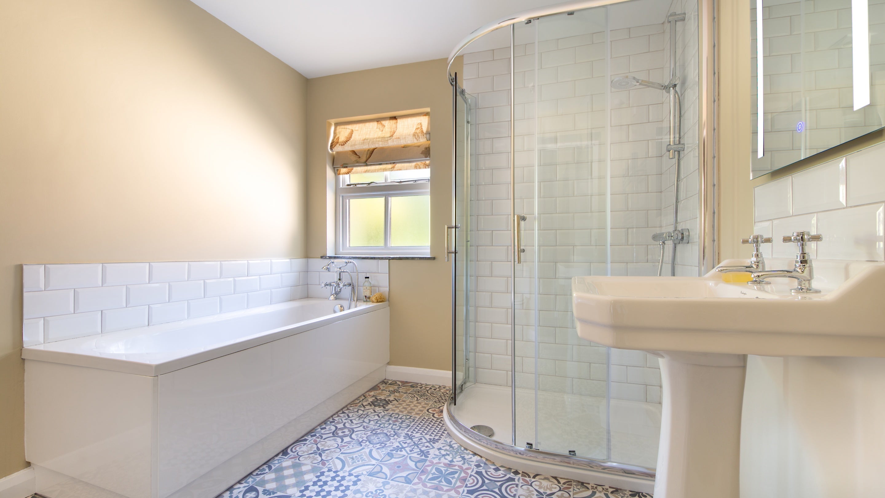 The bathroom on the ground floor of Castle Ward Gamekeeper's Lodge, with bath and separate shower, County Down