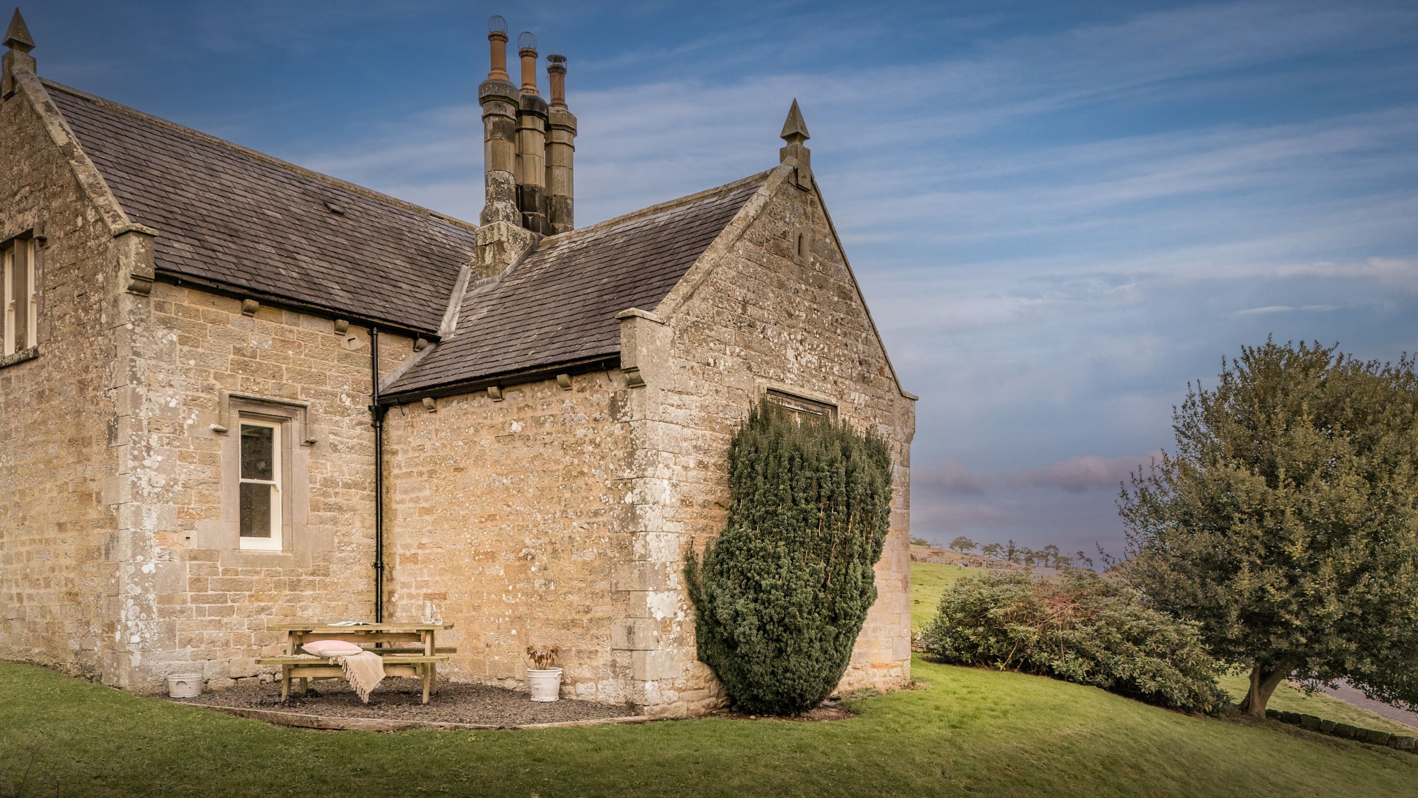 The exterior of Housesteads, its garden and outdoor seating, Northumberland