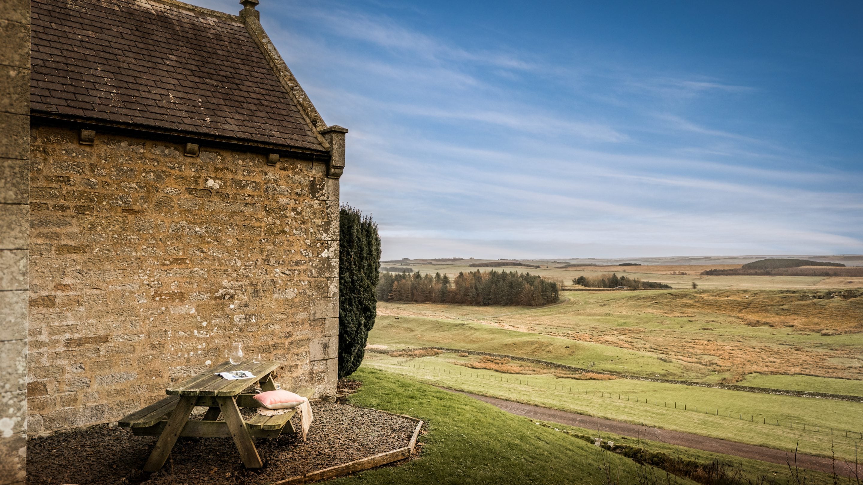 The outdoor seating area and views from the garden at Housesteads, Northumberland