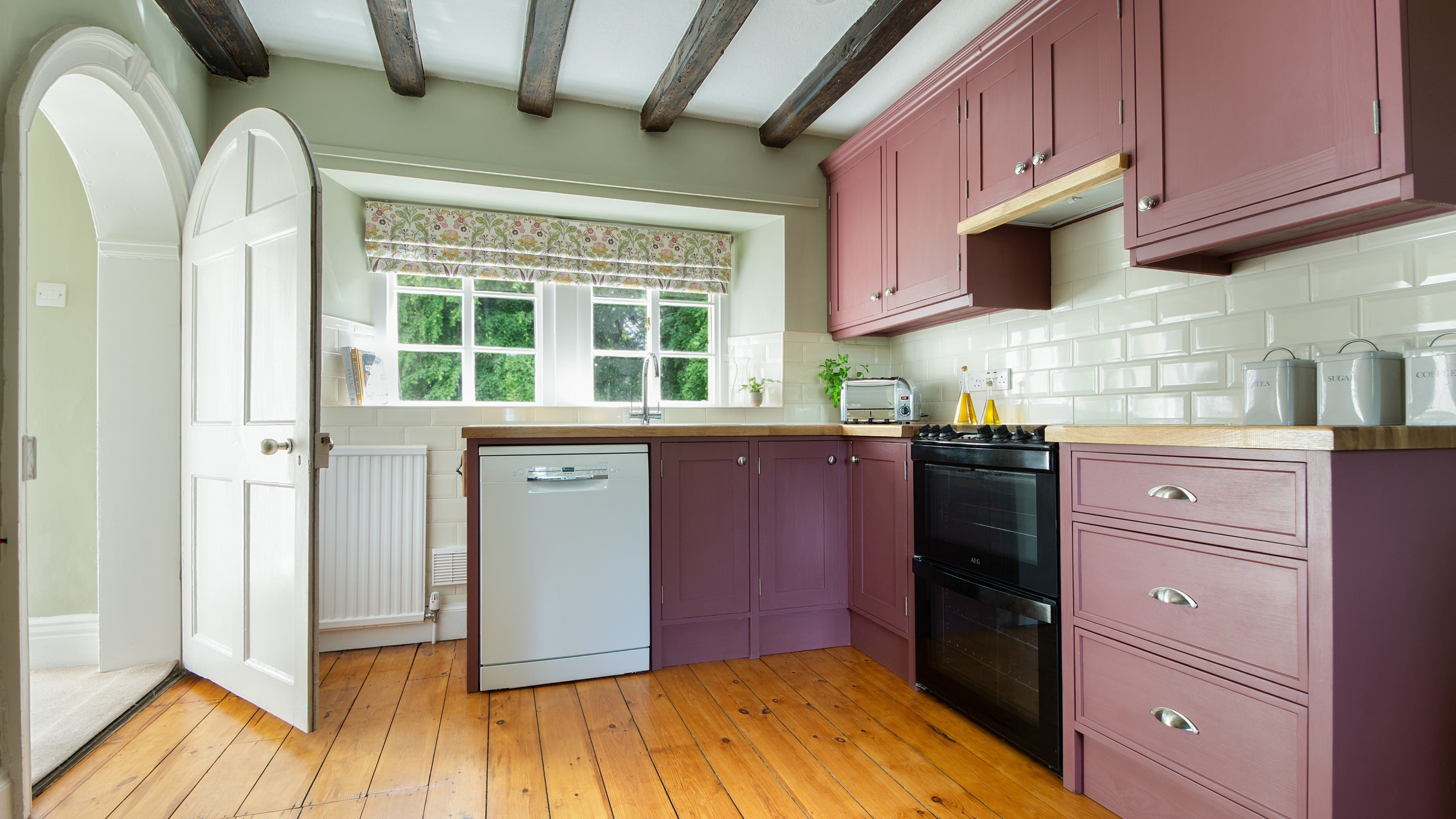 The kitchen with dishwasher, toaster, oven and hob at Laundry Cottage, Northumberland