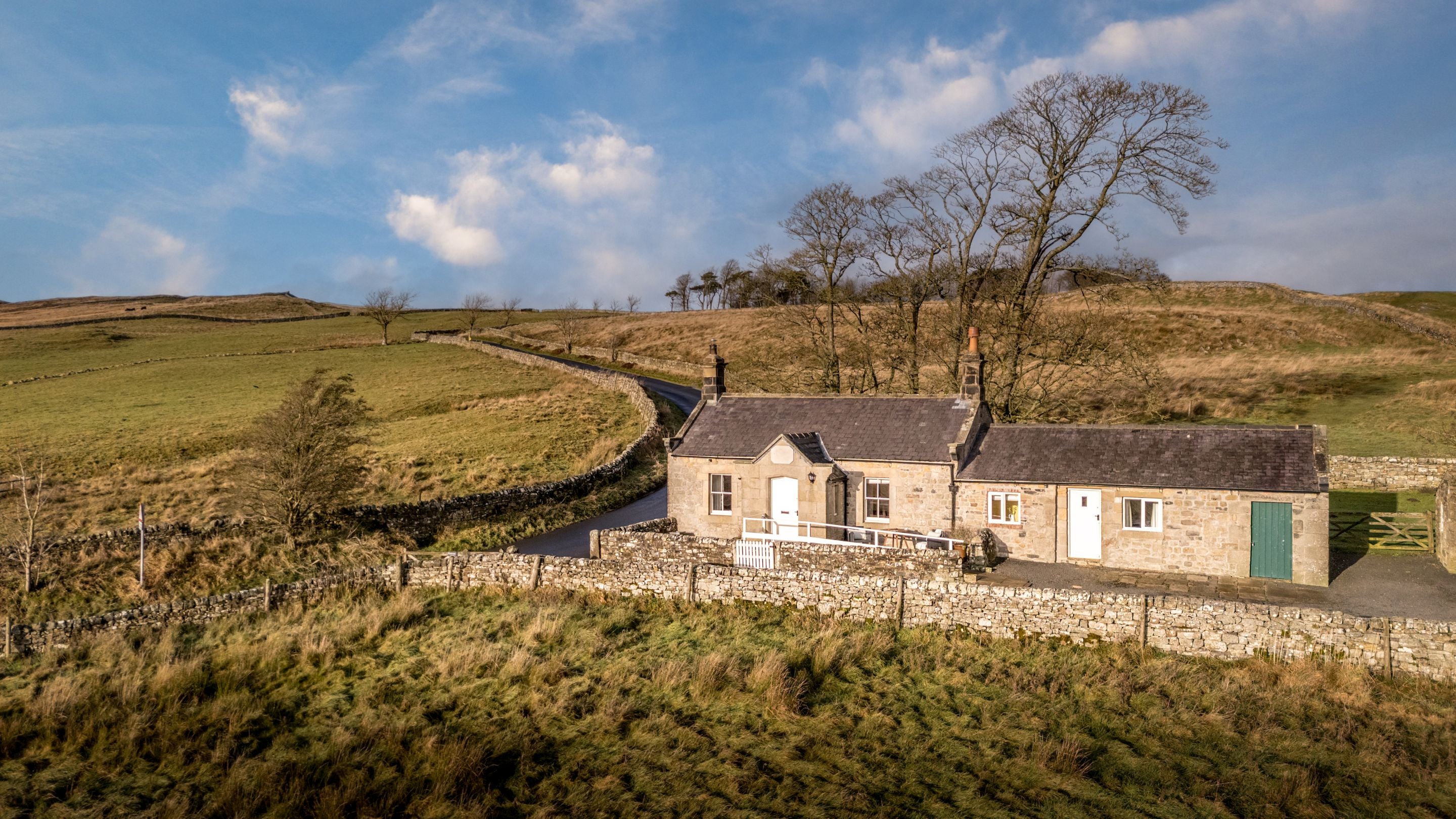 Peel Cottage, a single storey holiday cottage, part-way up a hill at the edge of Northumberland National Park, Northumberland