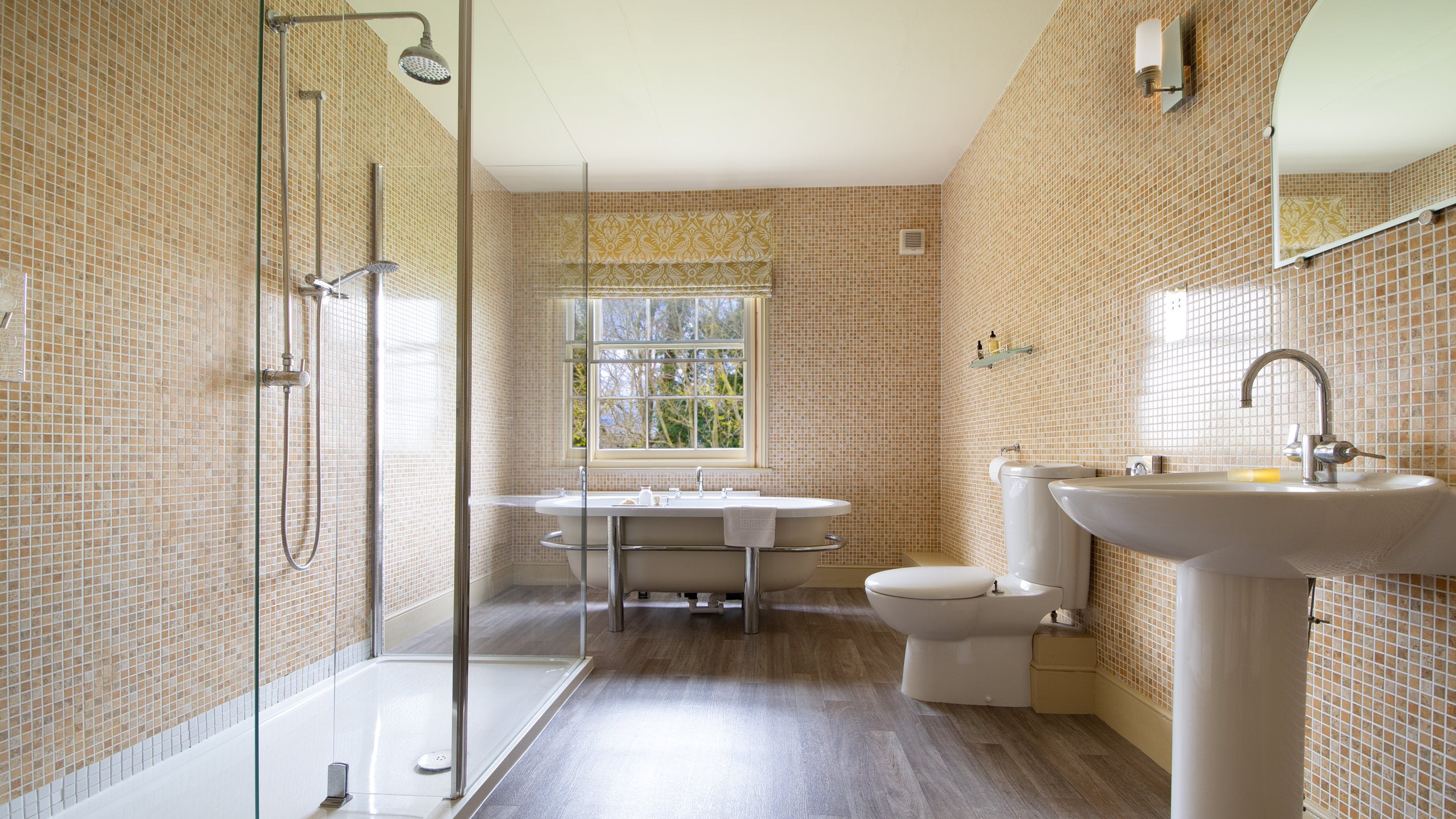 One of the bathrooms with freestanding bath and walk-in shower at Gunby Old Rectory, Lincolnshire