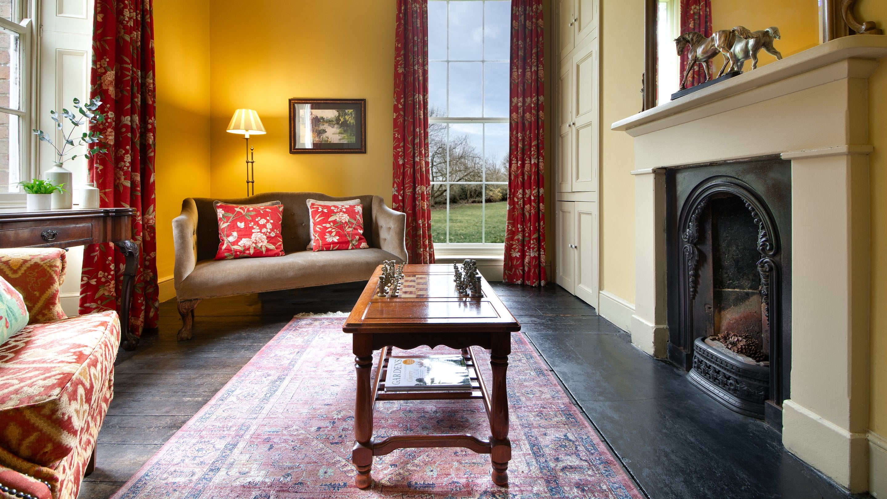 The small reception room with chess table at Gunby Old Rectory, Lincolnshire