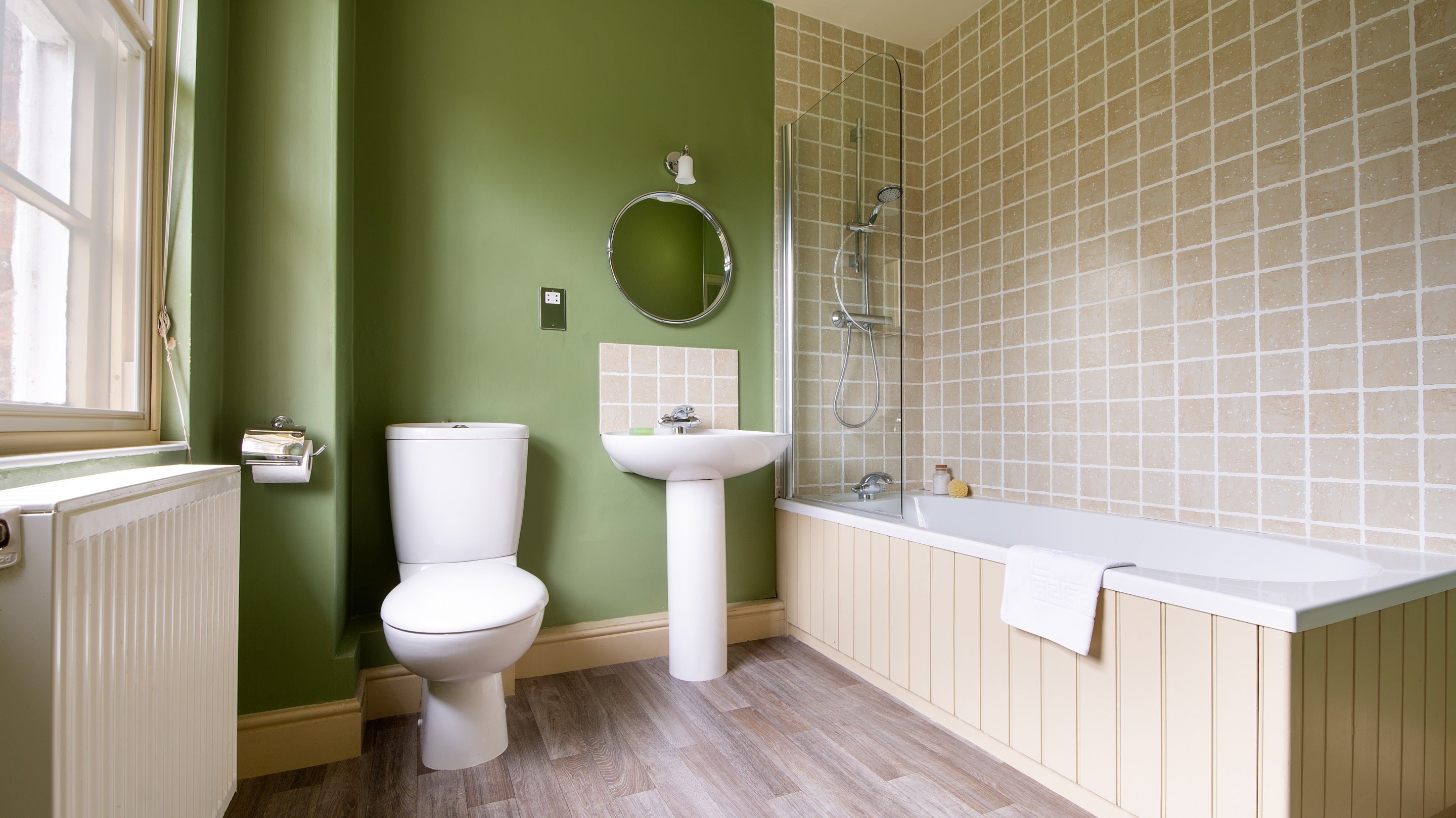 The en-suite bathroom with shower over bath at Gunby Old Rectory, Lincolnshire