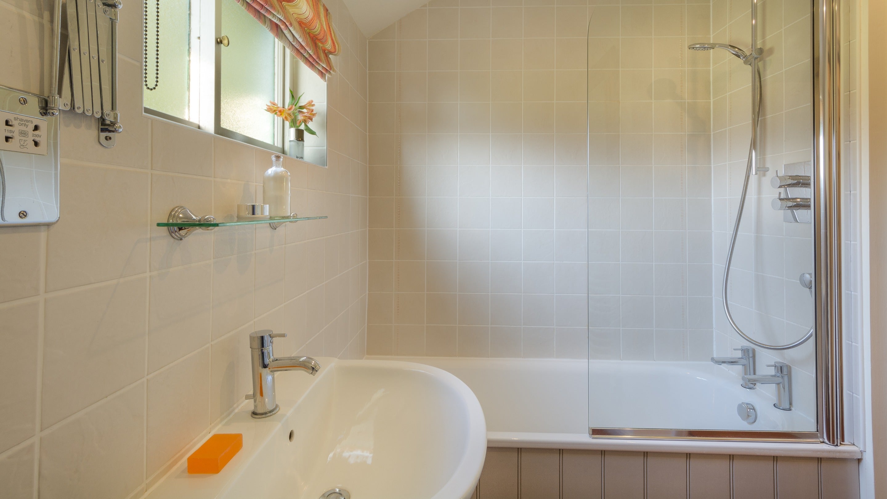 The bathroom, with shower over bath, at Whitegates Cottage, Lincolnshire
