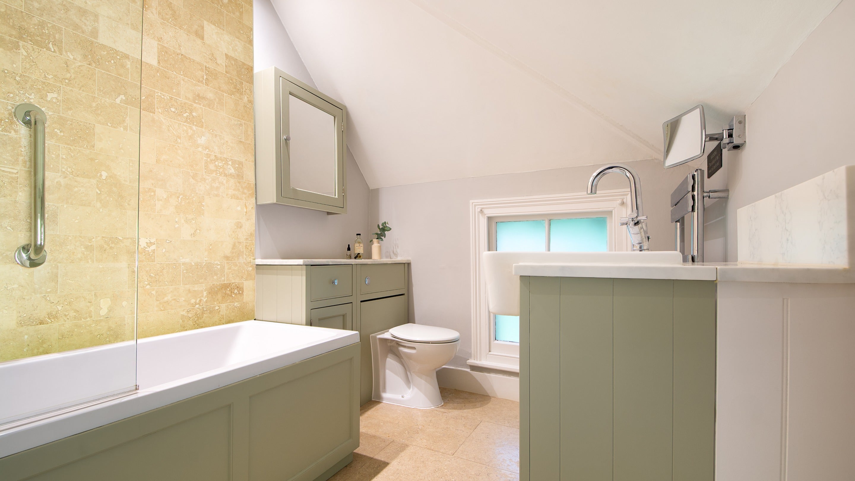 The bathroom at Cliveden New Cottage, with shower over bath, Berkshire