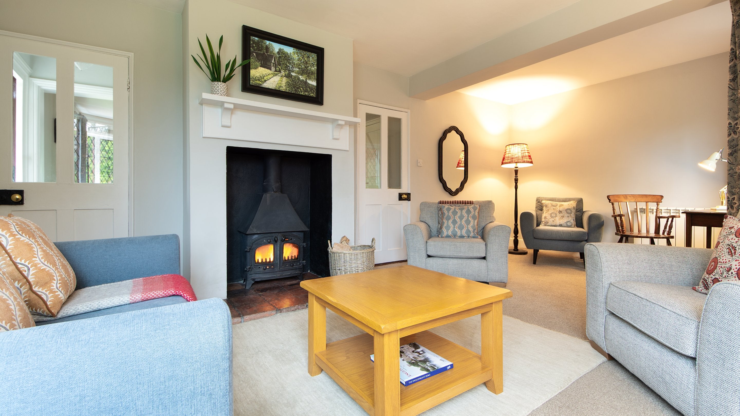 The sitting room with woodburner at Cliveden New Cottage, Berkshire
