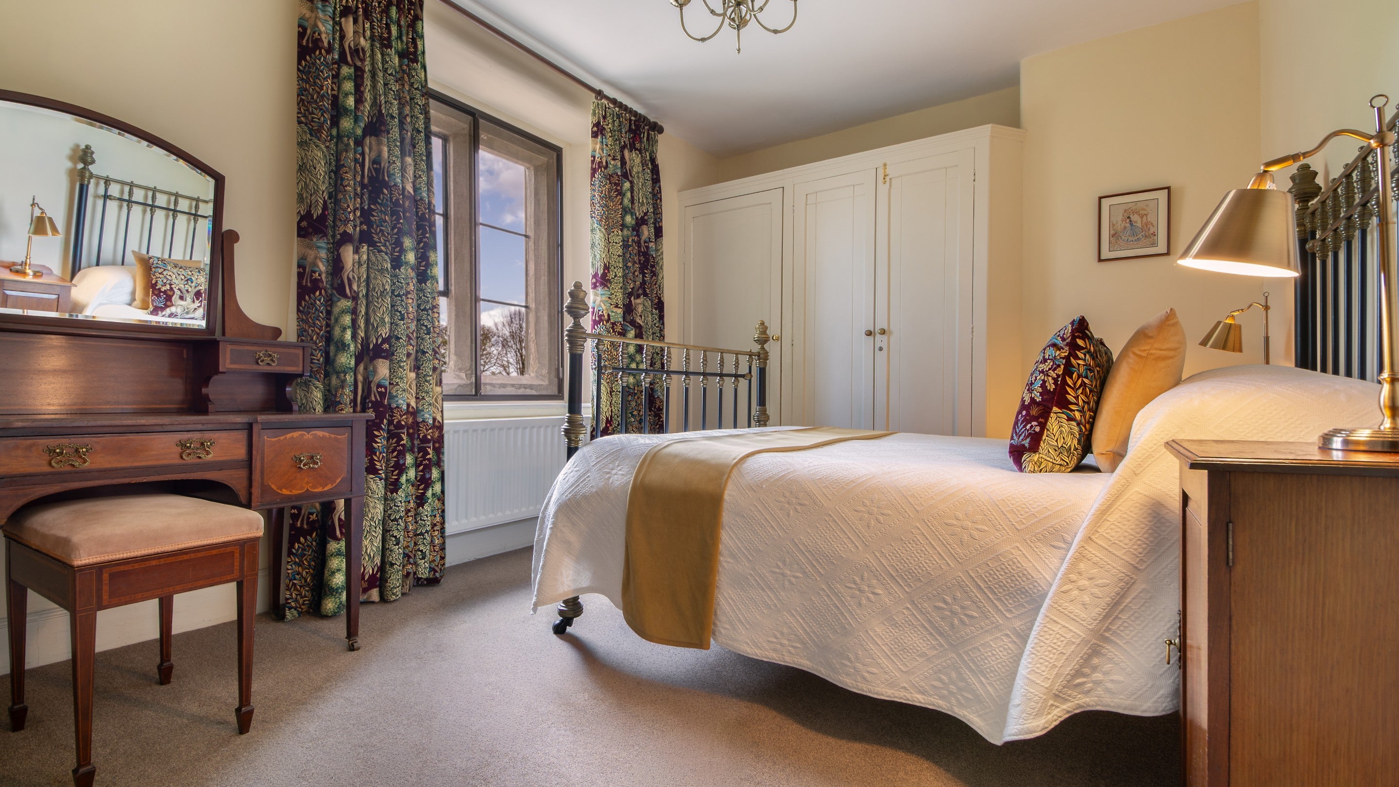 The double bedroom with antique brass bed on the first floor of 6 High Hazels, Derbyshire