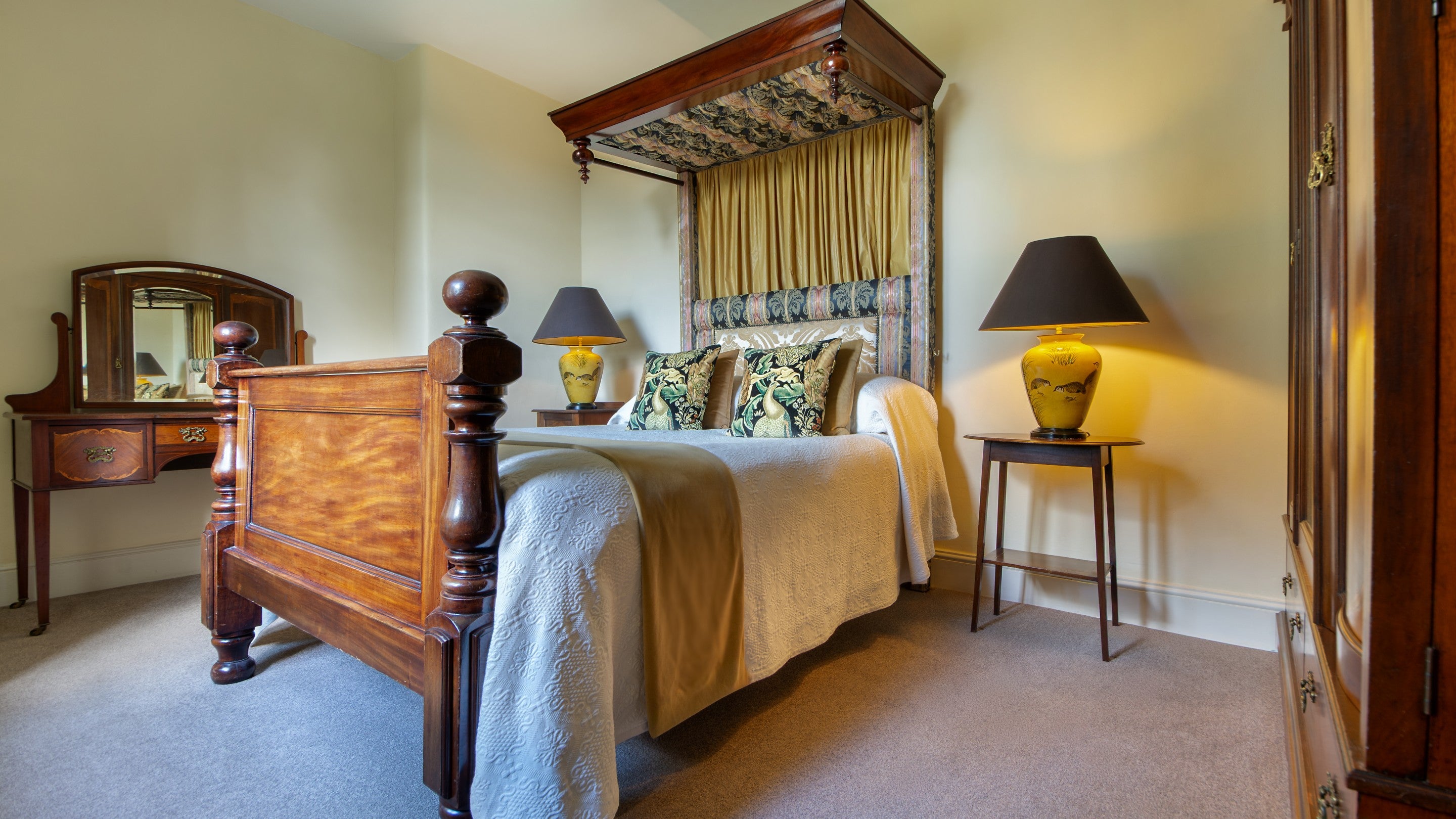 One of the double bedrooms on the first floor of 6 High Hazels, with antique half tester mahogany bed, Derbyshire