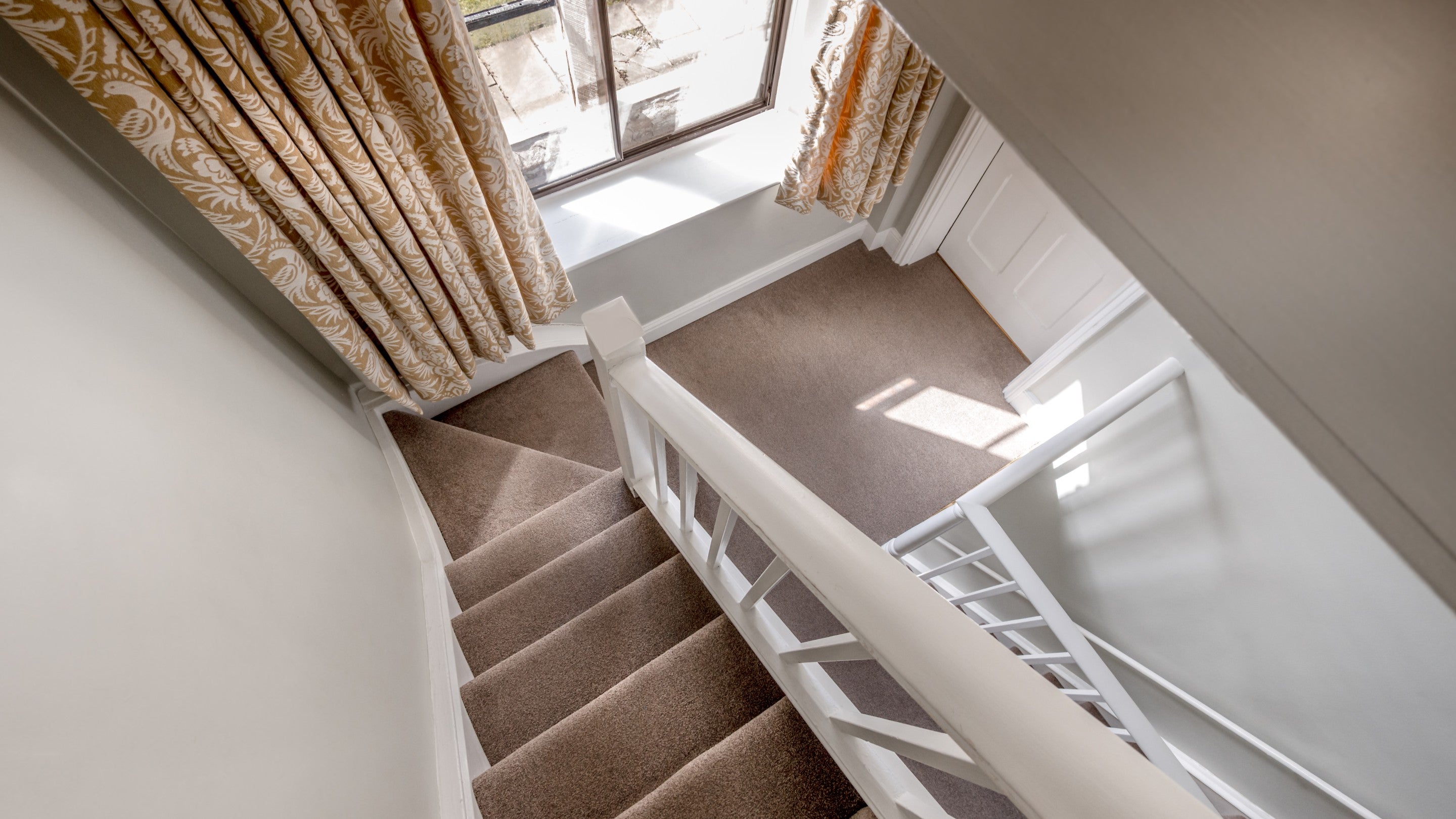 Looking down the second-floor stairs to the first-floor landing of 6 High Hazels, Derbyshire