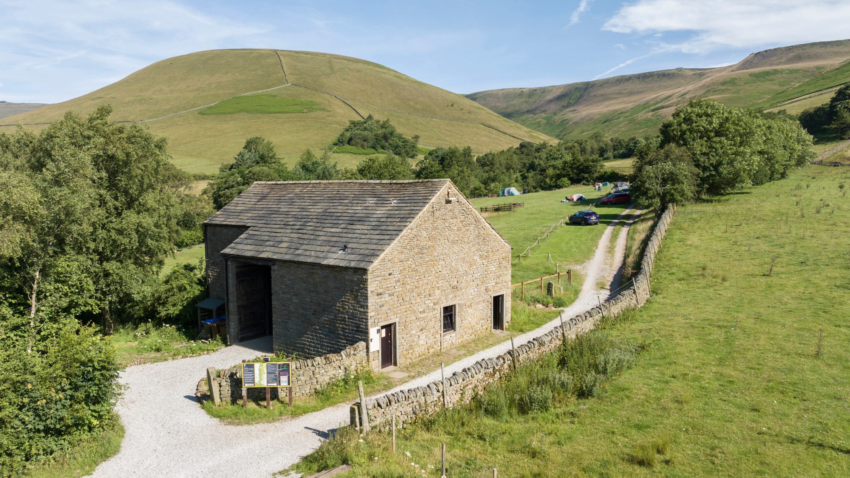 The barn with reception, shop and the camping barn at Upper Booth Farm Campsite, Derbyshire