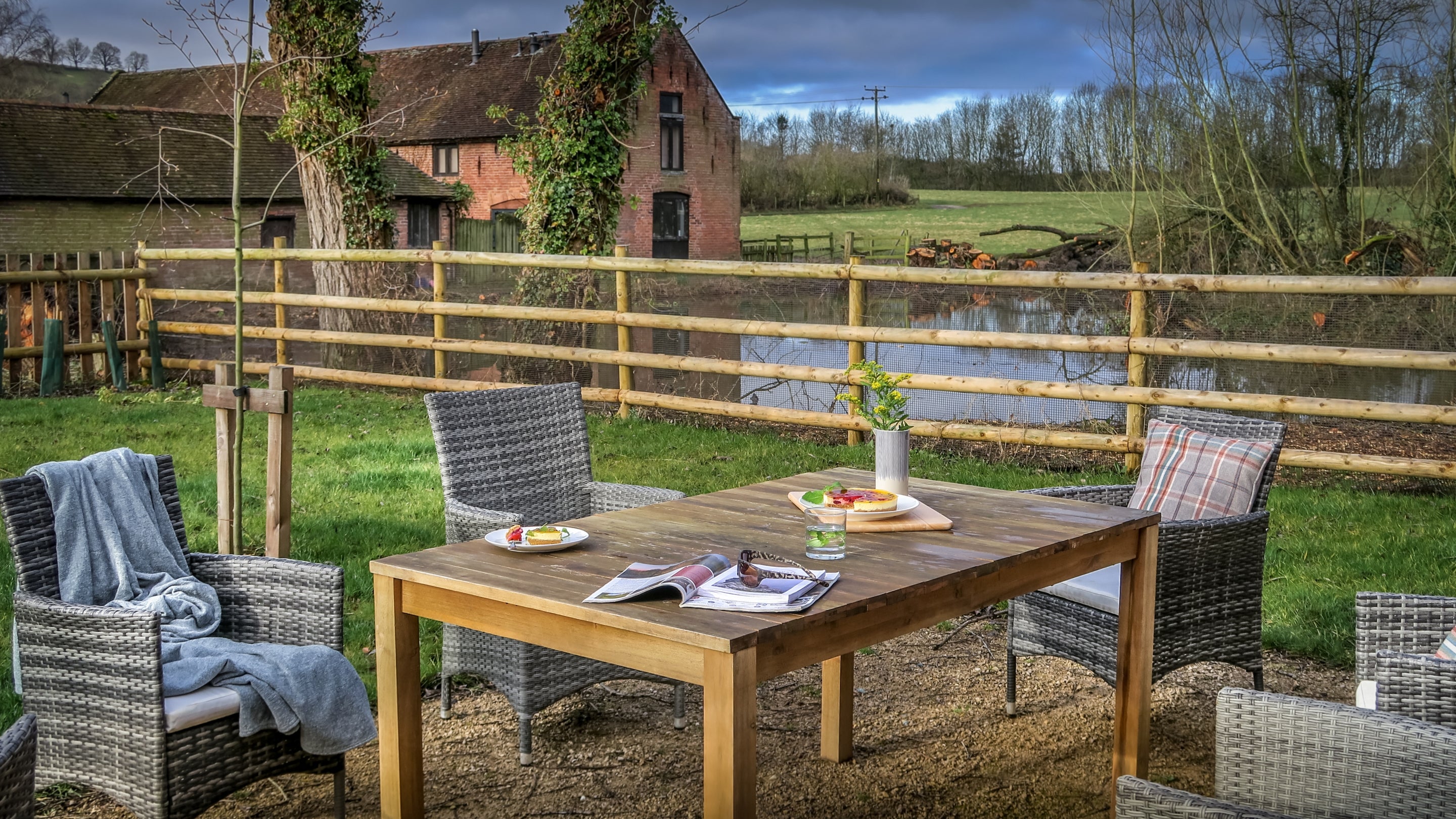 Outdoor furniture in the shared garden at 1 Morville Barn, Shropshire