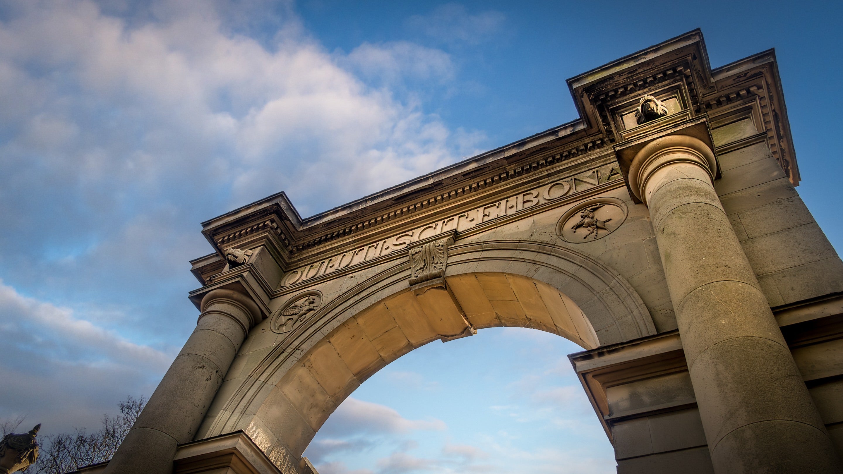 Looking up at the carved stone archway above the entrance gate at Attingham East Lodge, Shropshire