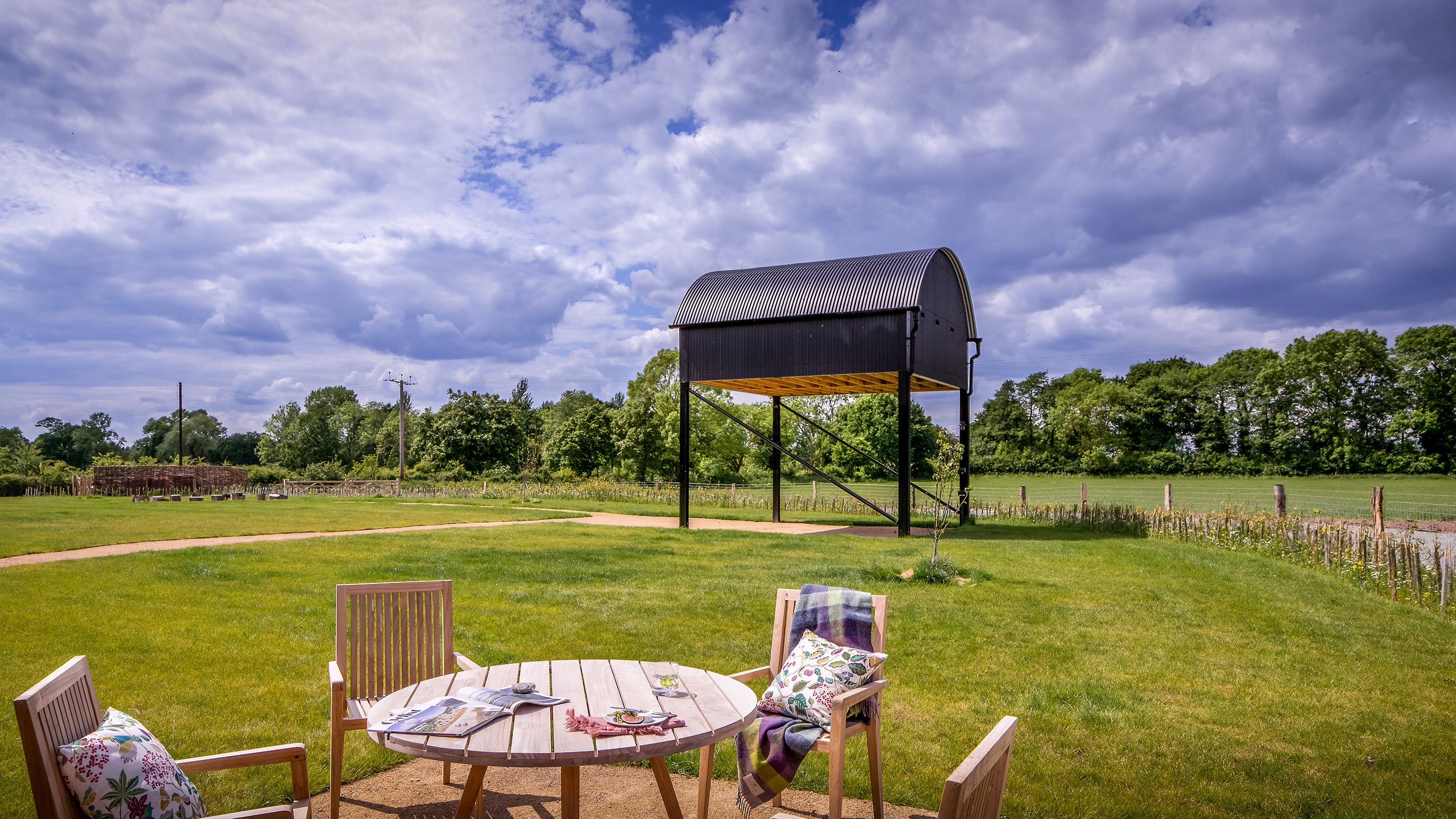 The outdoor seating and shared garden at Forge Barn, Shropshire