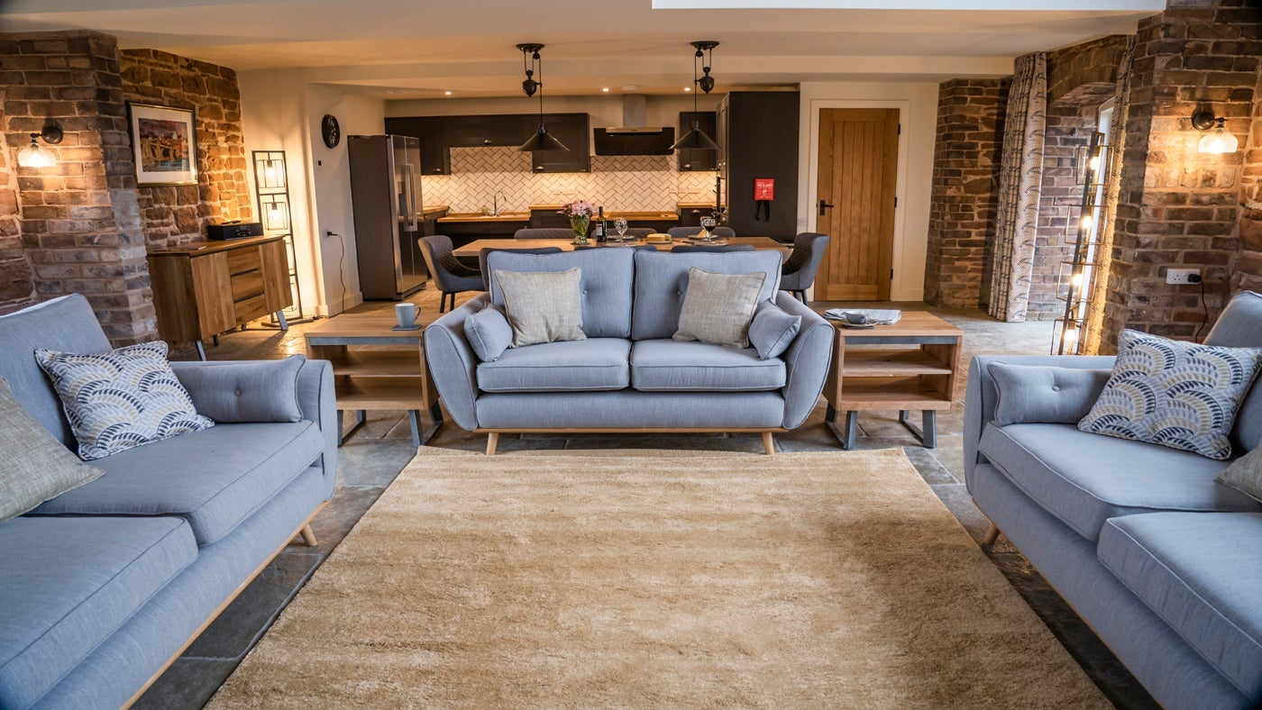 The open-plan kitchen, dining and sitting room at Sandybury Barn, Shropshire