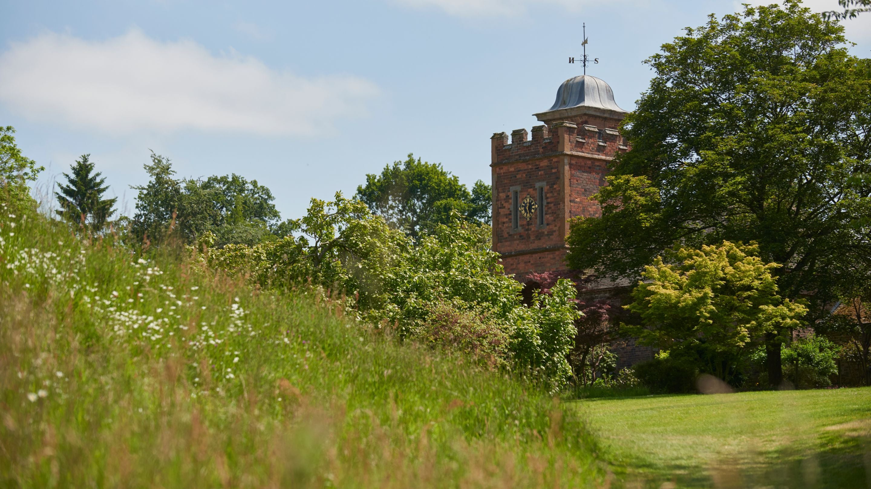 View of the Stableyard clock tower in the grounds of Dudmaston Hall, Shropshire