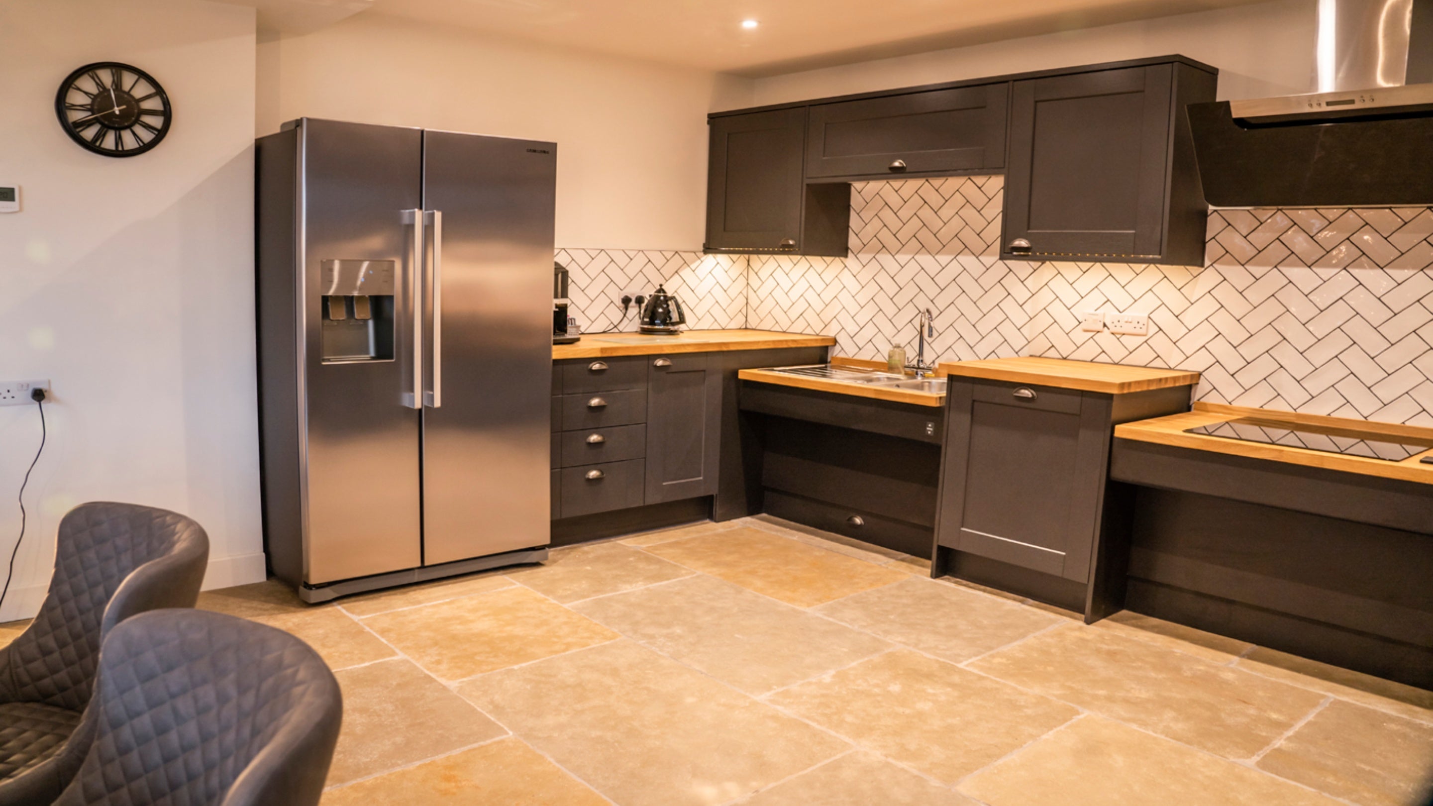 The kitchen - with the adjustable sink and hob in a lowered position - at Sandybury Barn, Shropshire