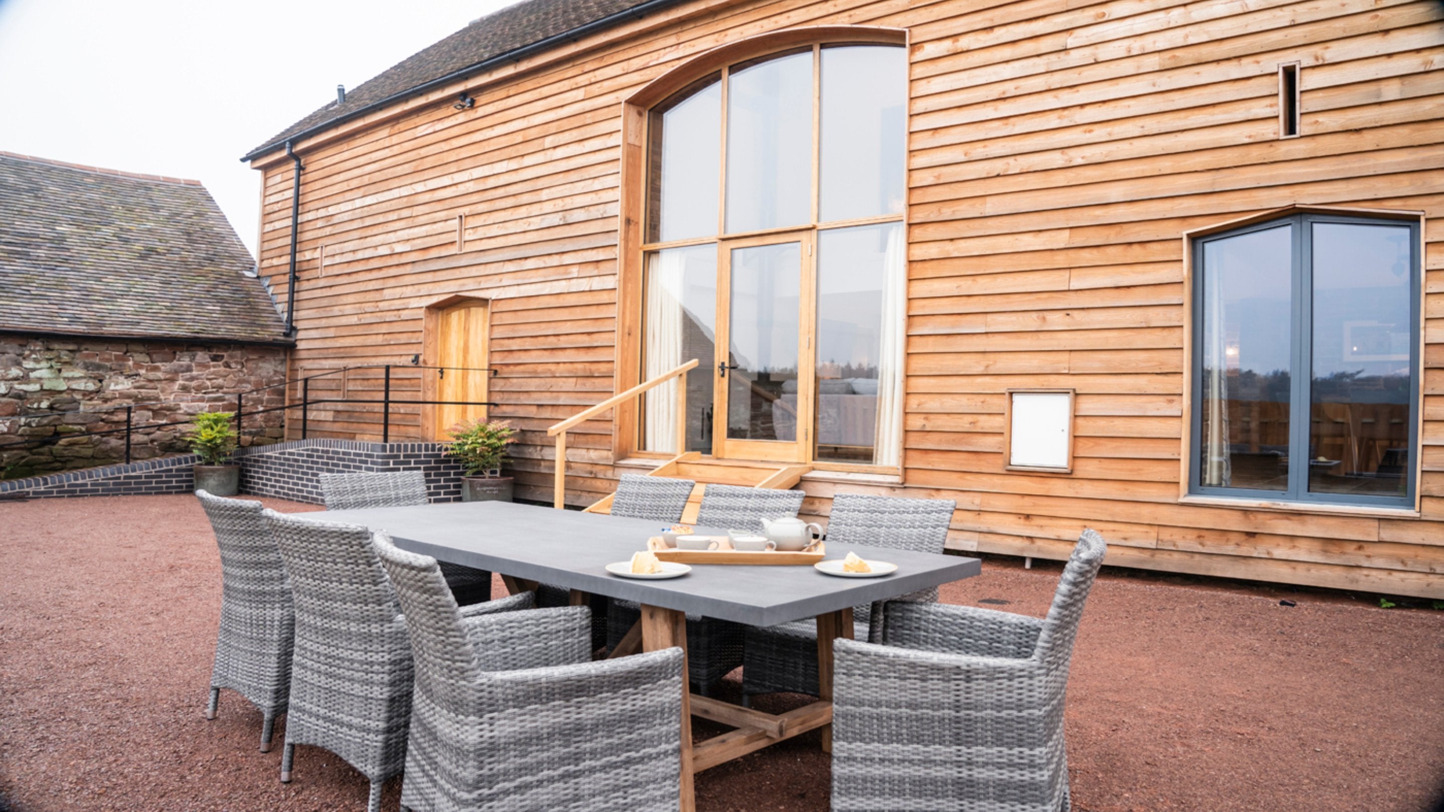 The outdoor dining furniture in the garden of Sandybury Barn, Shropshire