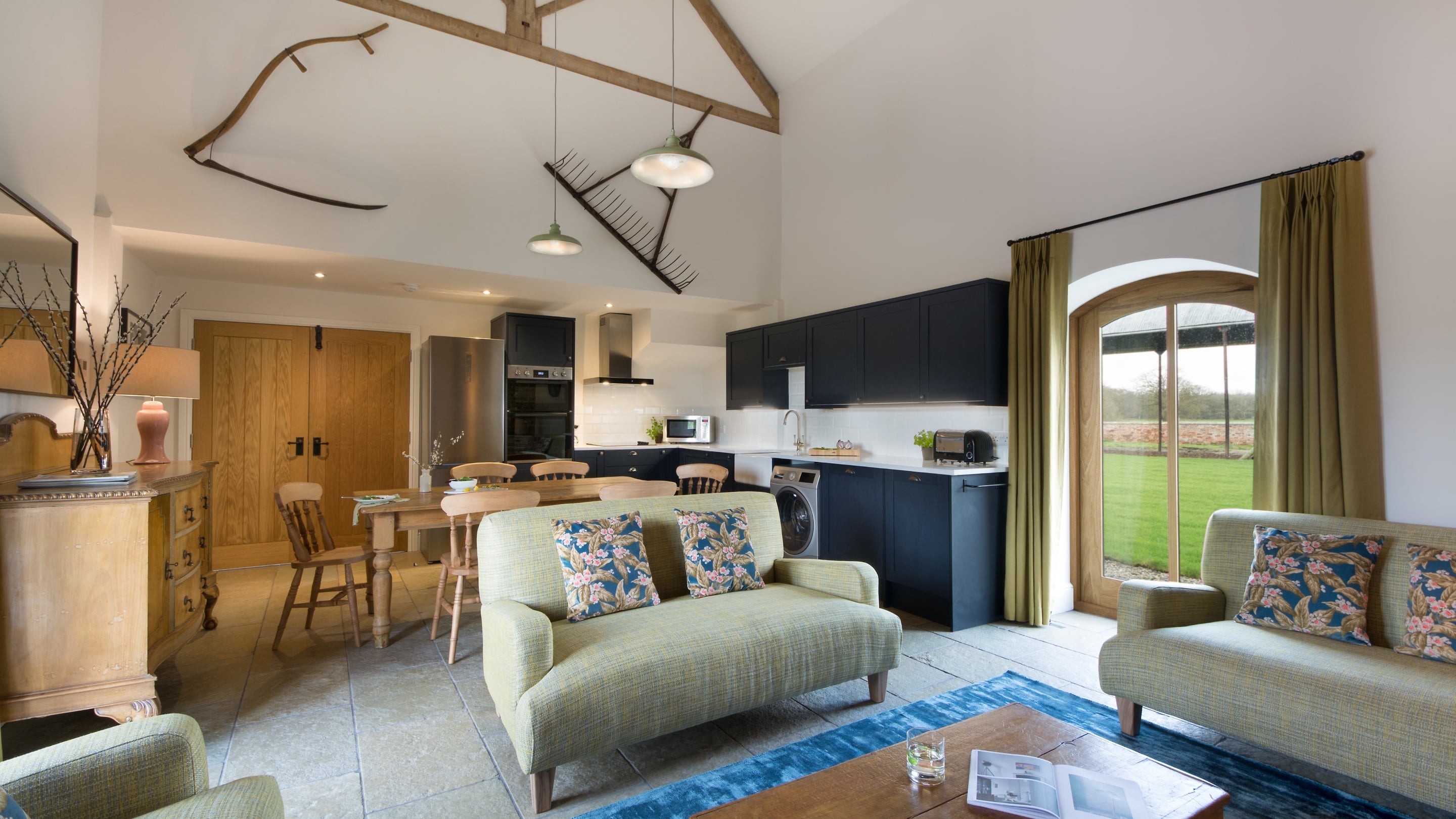 The open-plan kitchen, dining and sitting room at Threshing Barn, Shropshire
