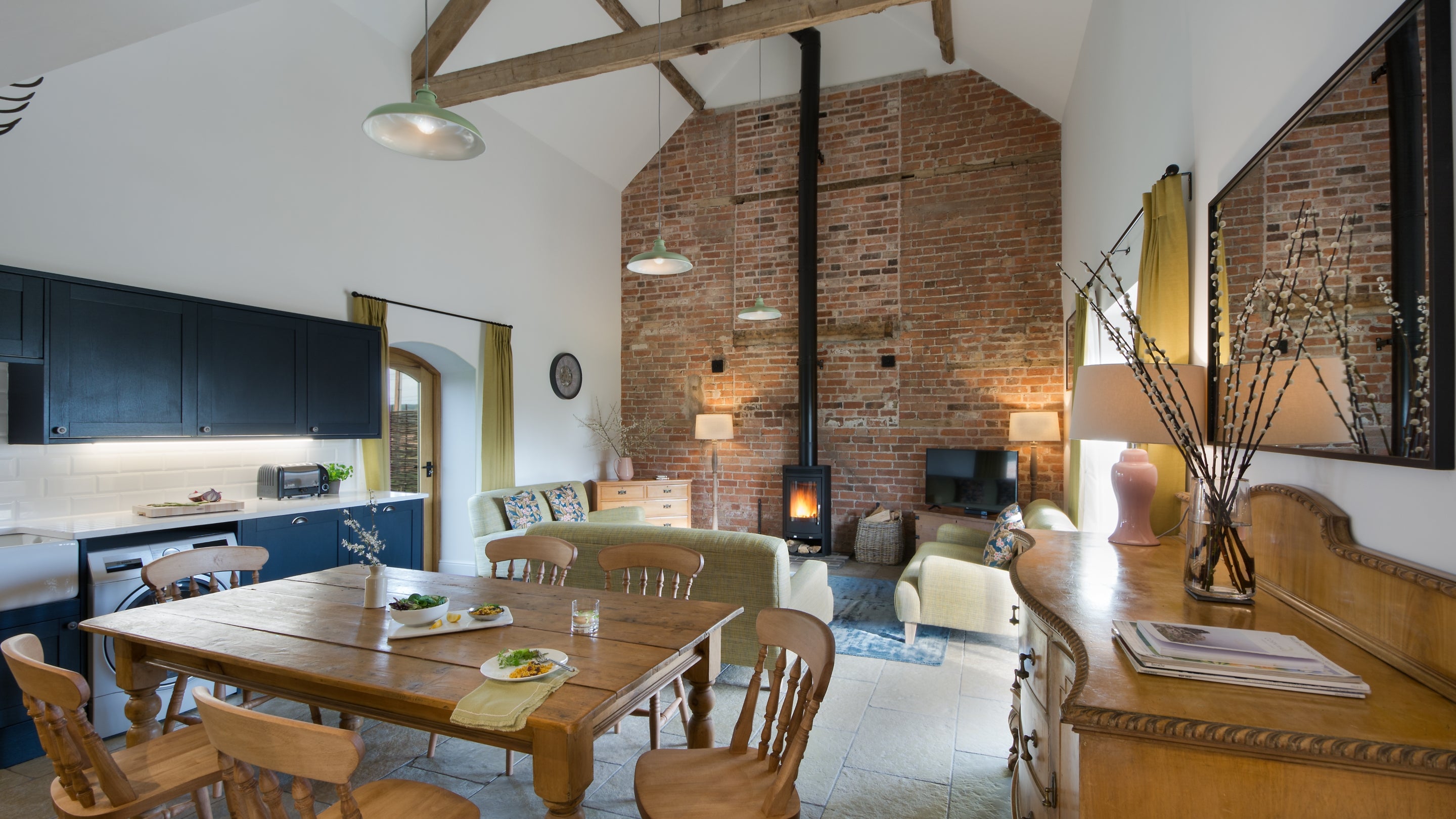 The open plan kitchen, dining and sitting room at Threshing Barn, Shropshire