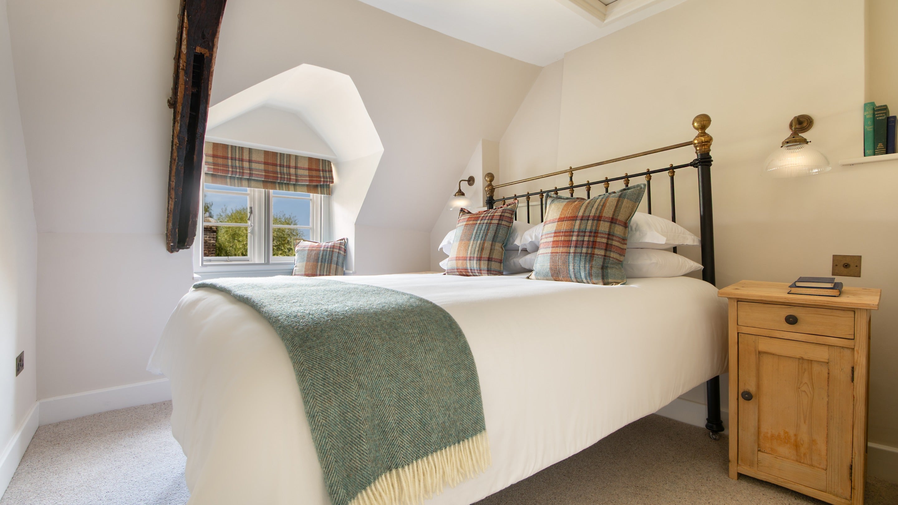 The double bedroom at 20 Church Street, with window seat, Wiltshire