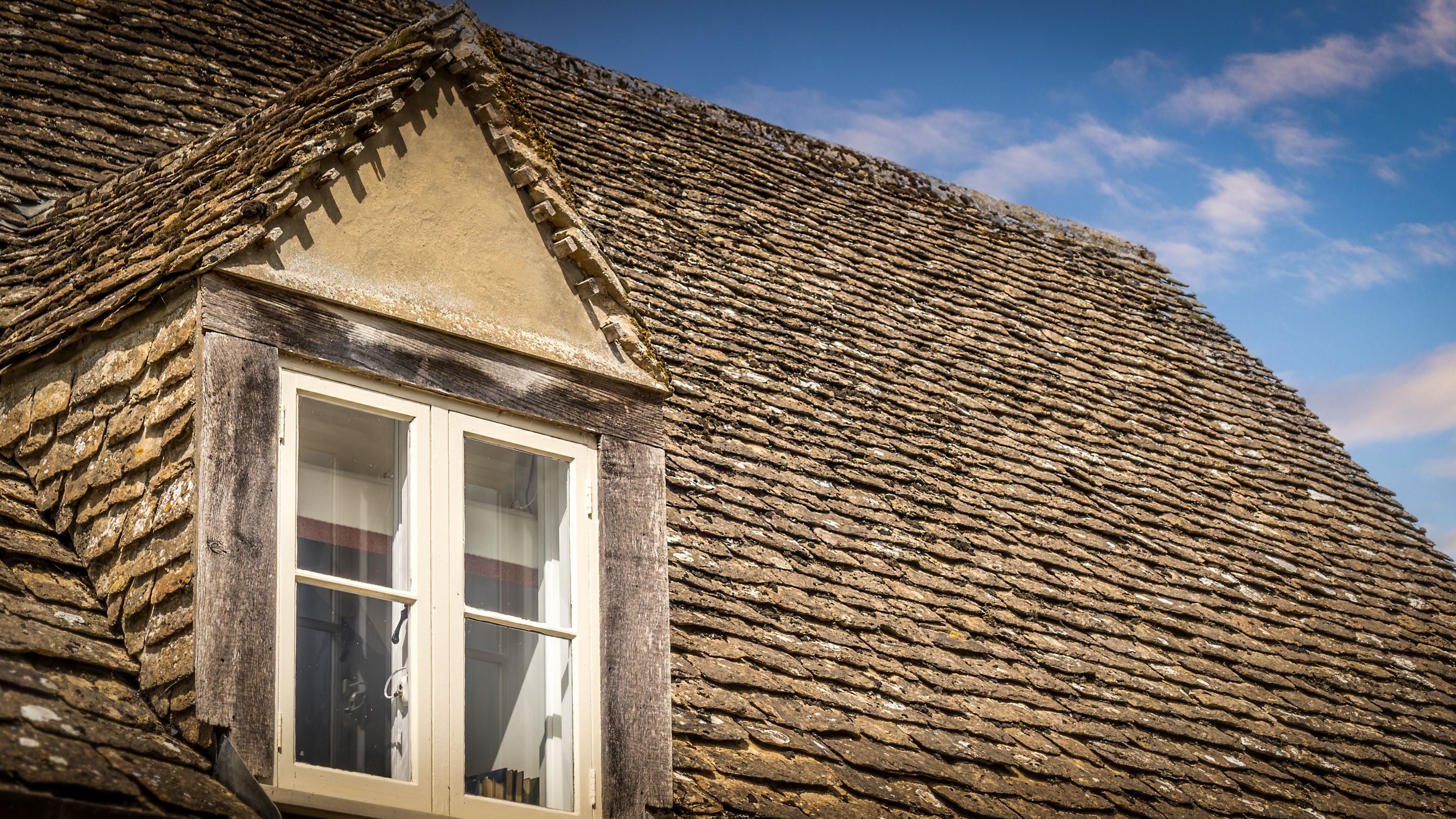 The roof and a gable window at 20 Church Street, Wiltshire