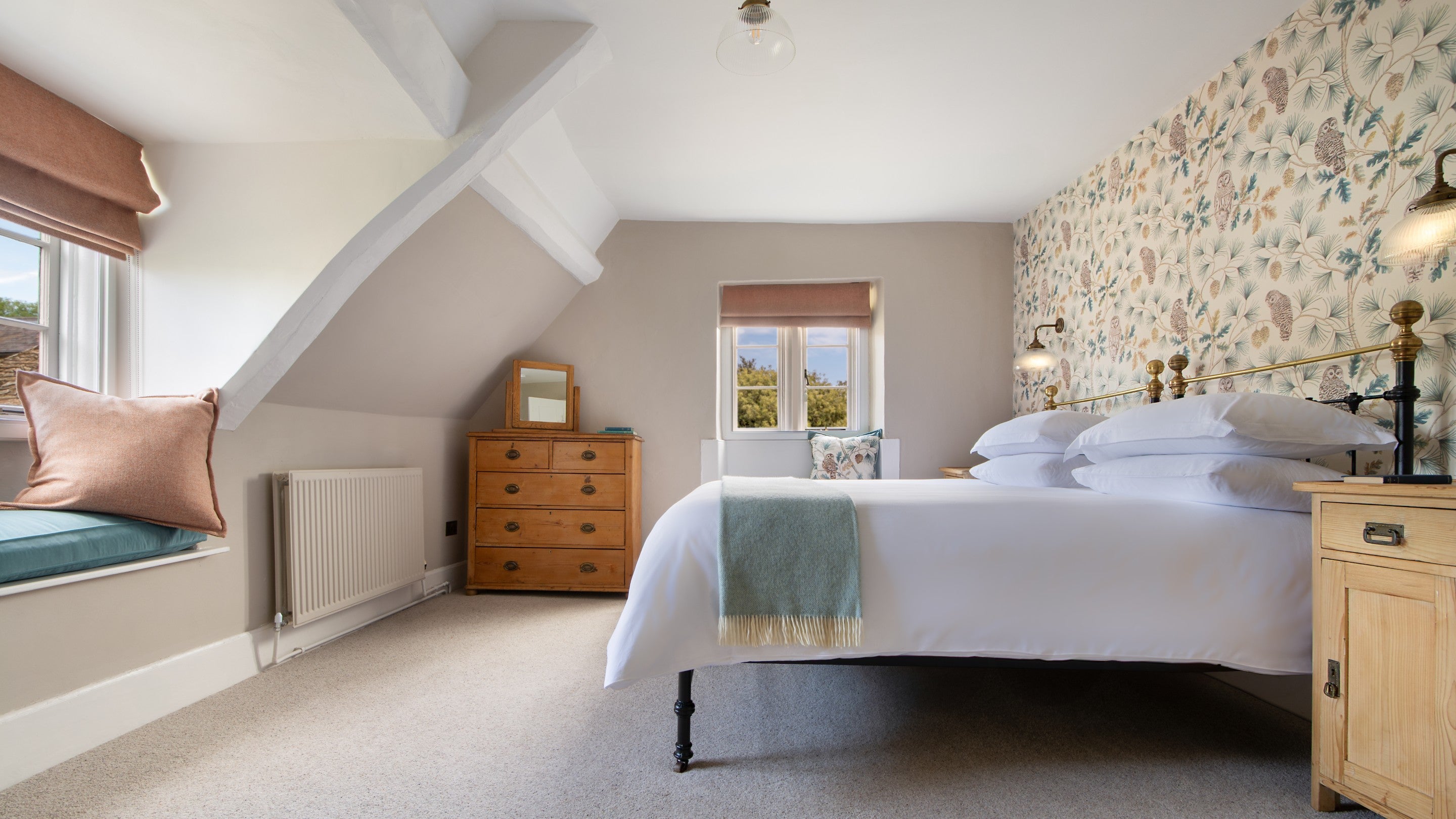 The super king-size bedroom at 20 Church Street, with window seats, Wiltshire