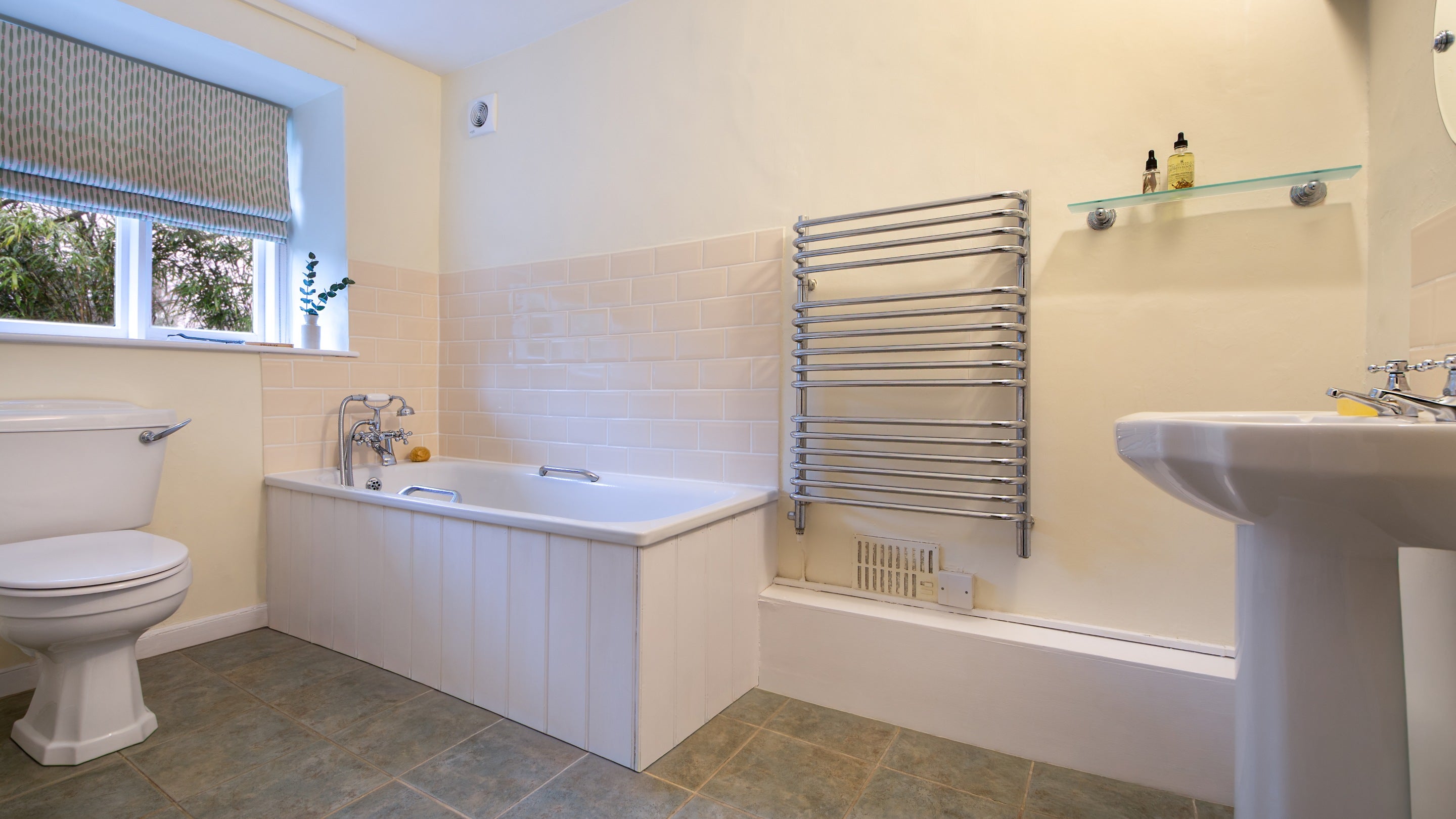 The bathroom at 89 Church Lawn with bath with shower attachment (no wall hook), Wiltshire