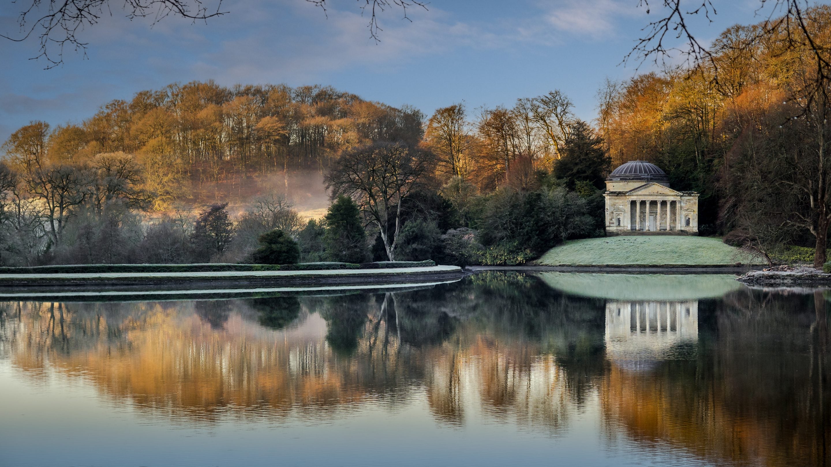 The Pantheon, a stone temple with domed roof and portico, which overlooks the lake in Stourhead's garden, Wiltshire