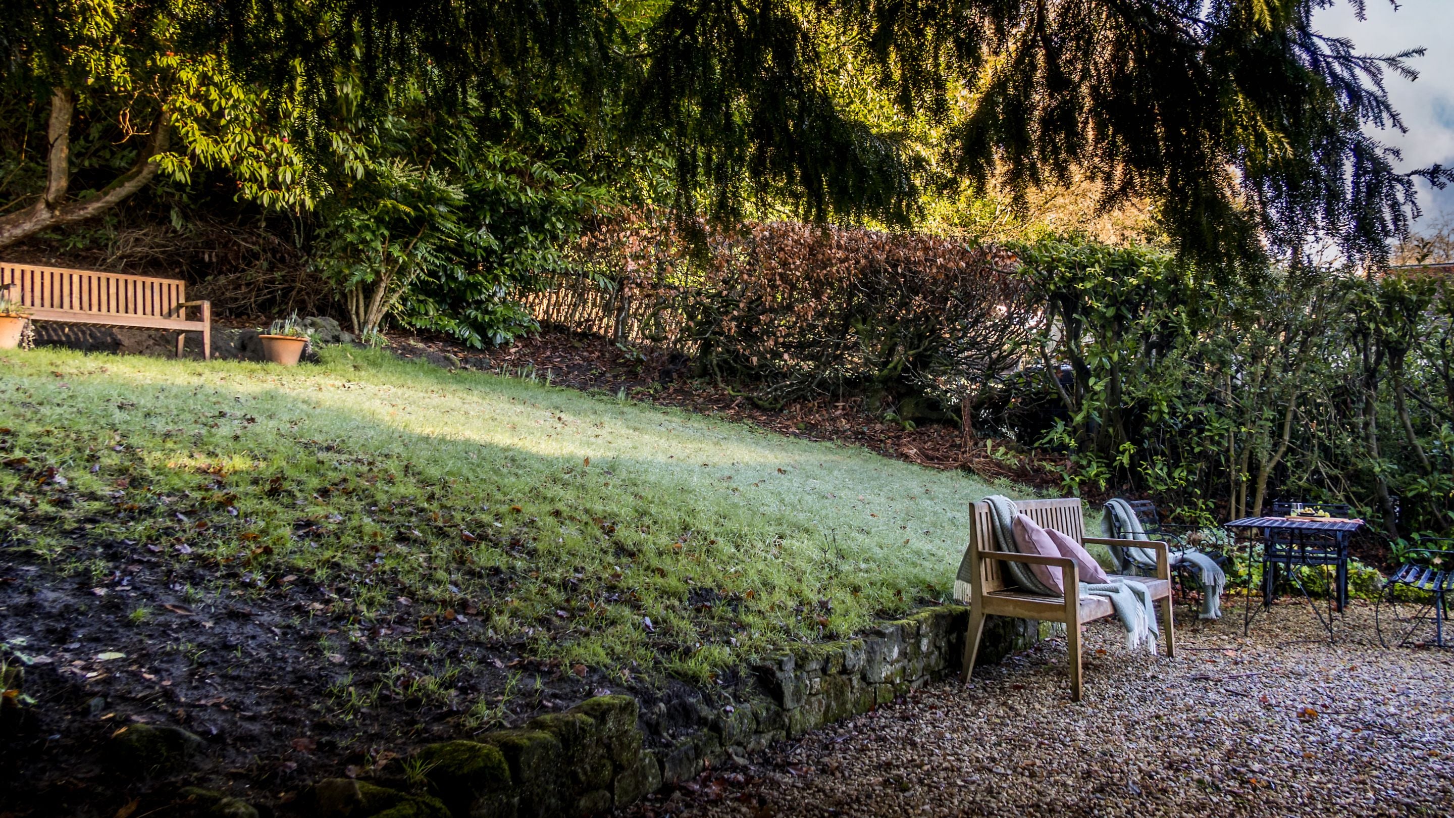The sloped lawn in the private garden at 89 Church Lawn, Wiltshire