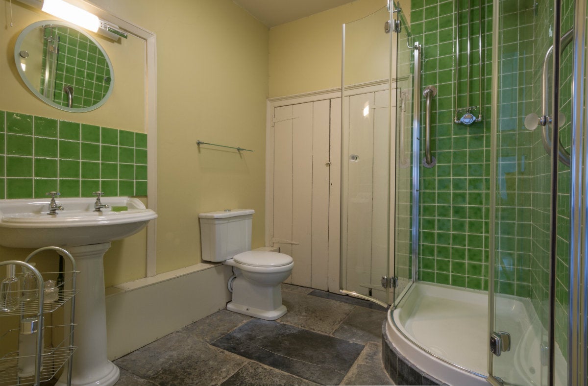 The en-suite to the ground-floor twin bedroom at Lytes Cary, Somerset