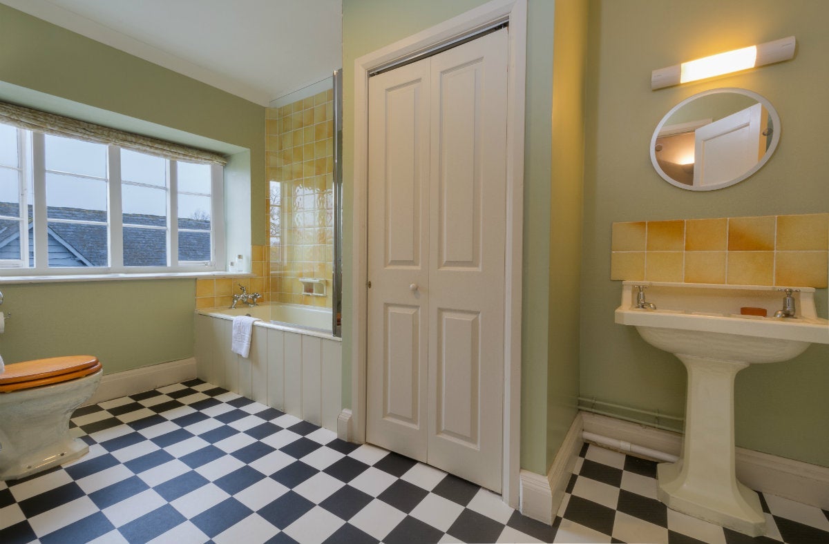 First-floor bathroom with shower over bath at Lytes Cary, Somerset