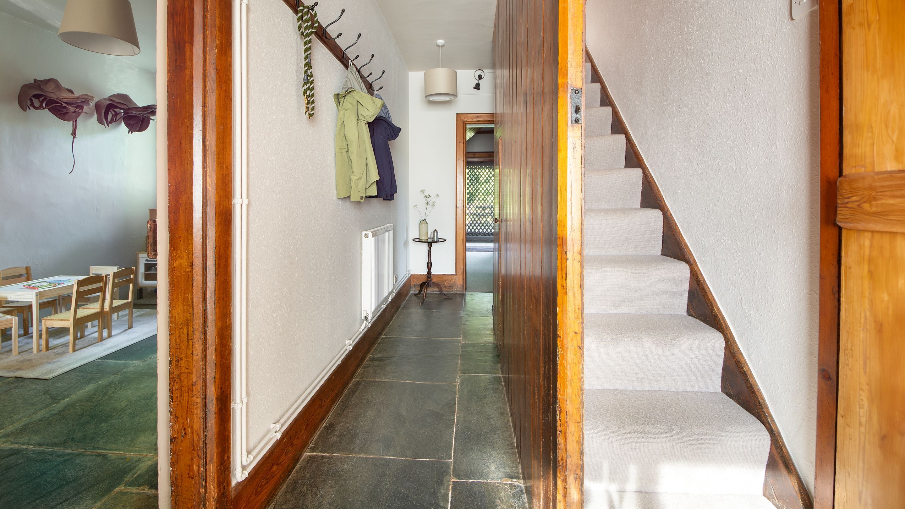 The hallway and narrow back staircase at Selworthy Farmhouse, Somerset