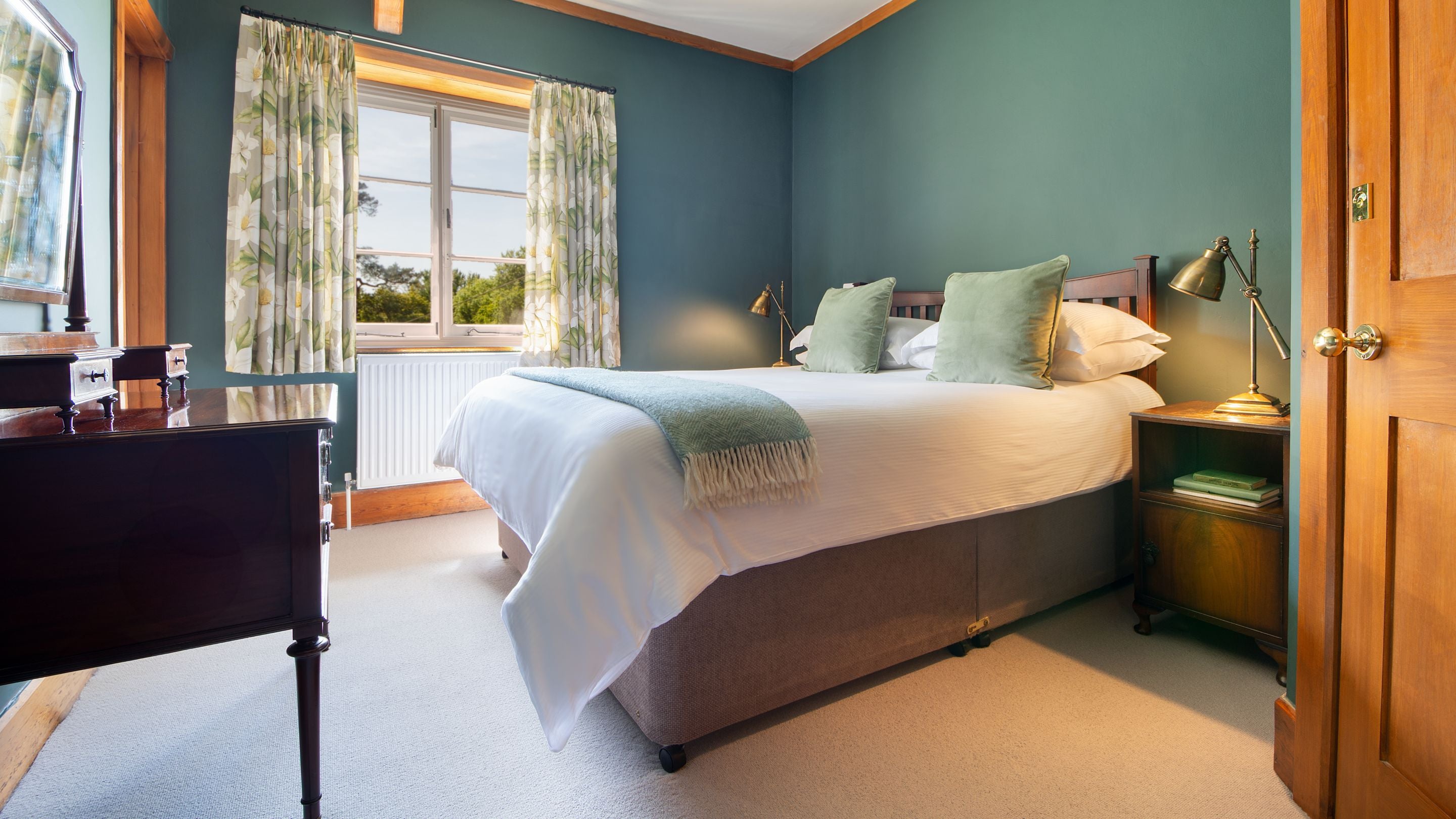 The second double bedroom - which has an en-suite shower room and is also joined to the twin room - at Selworthy Farmhouse, Somerset