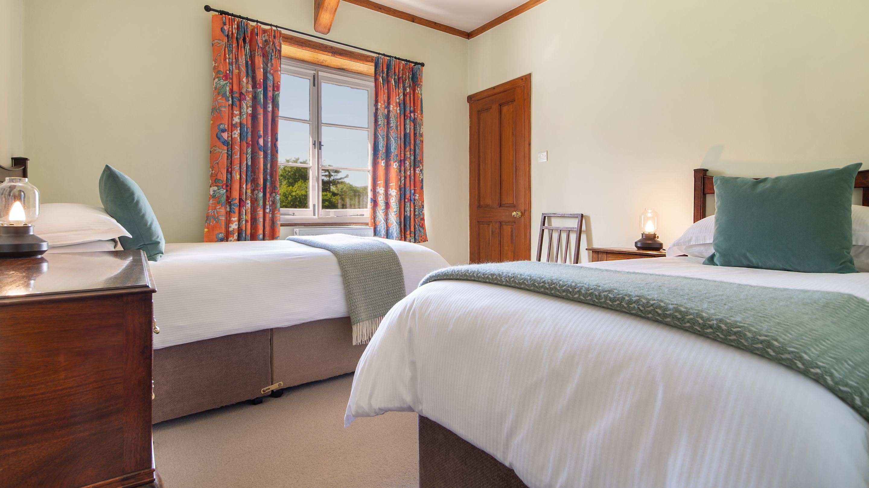 The twin bedroom - which is joined to the second double bedroom and also has its own access to the landing - at Selworthy Farmhouse, Somerset