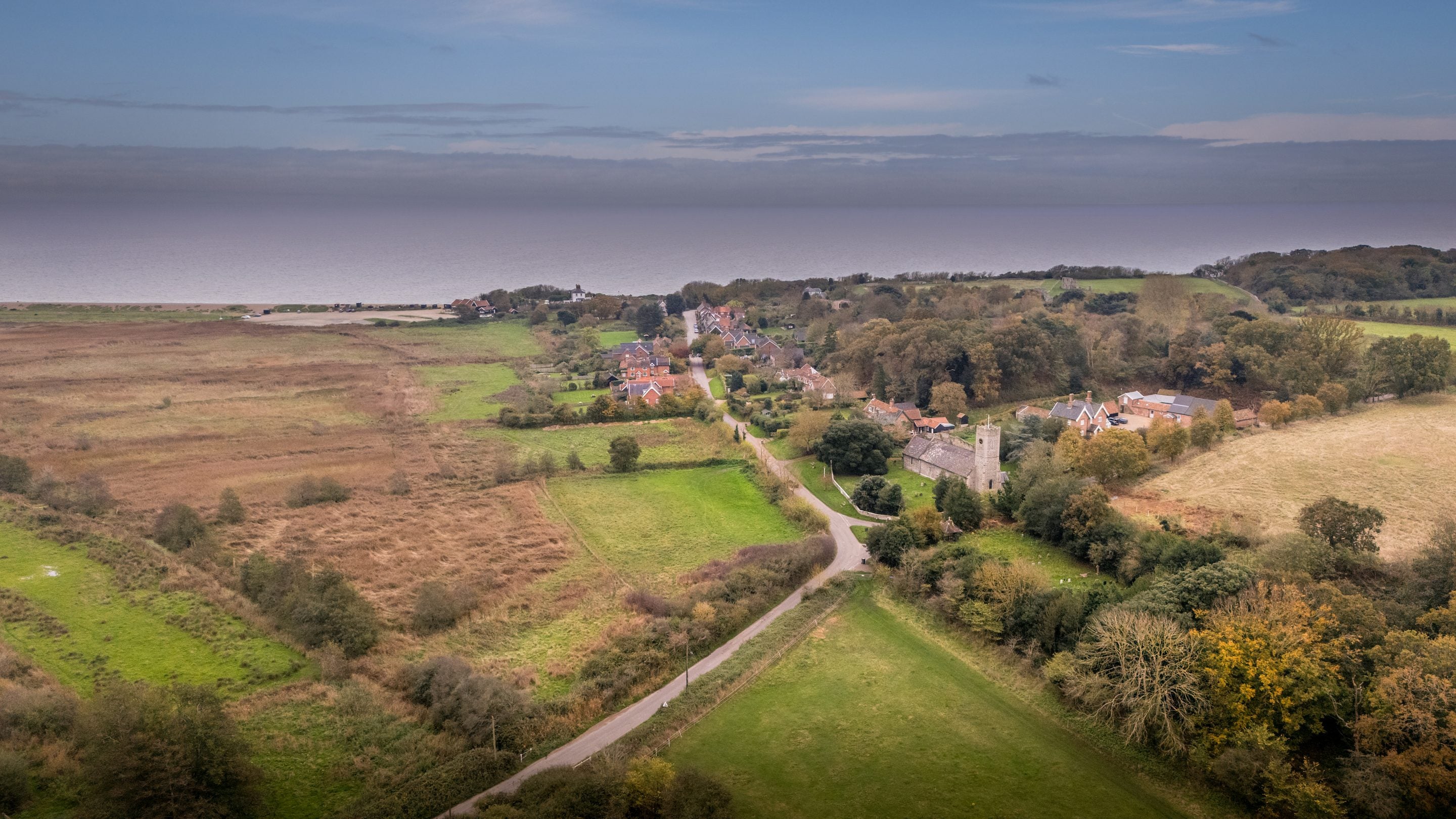 An aerial view of Dunwich village and the coast near Bridge Farm Cottage in autumn, Suffolk
