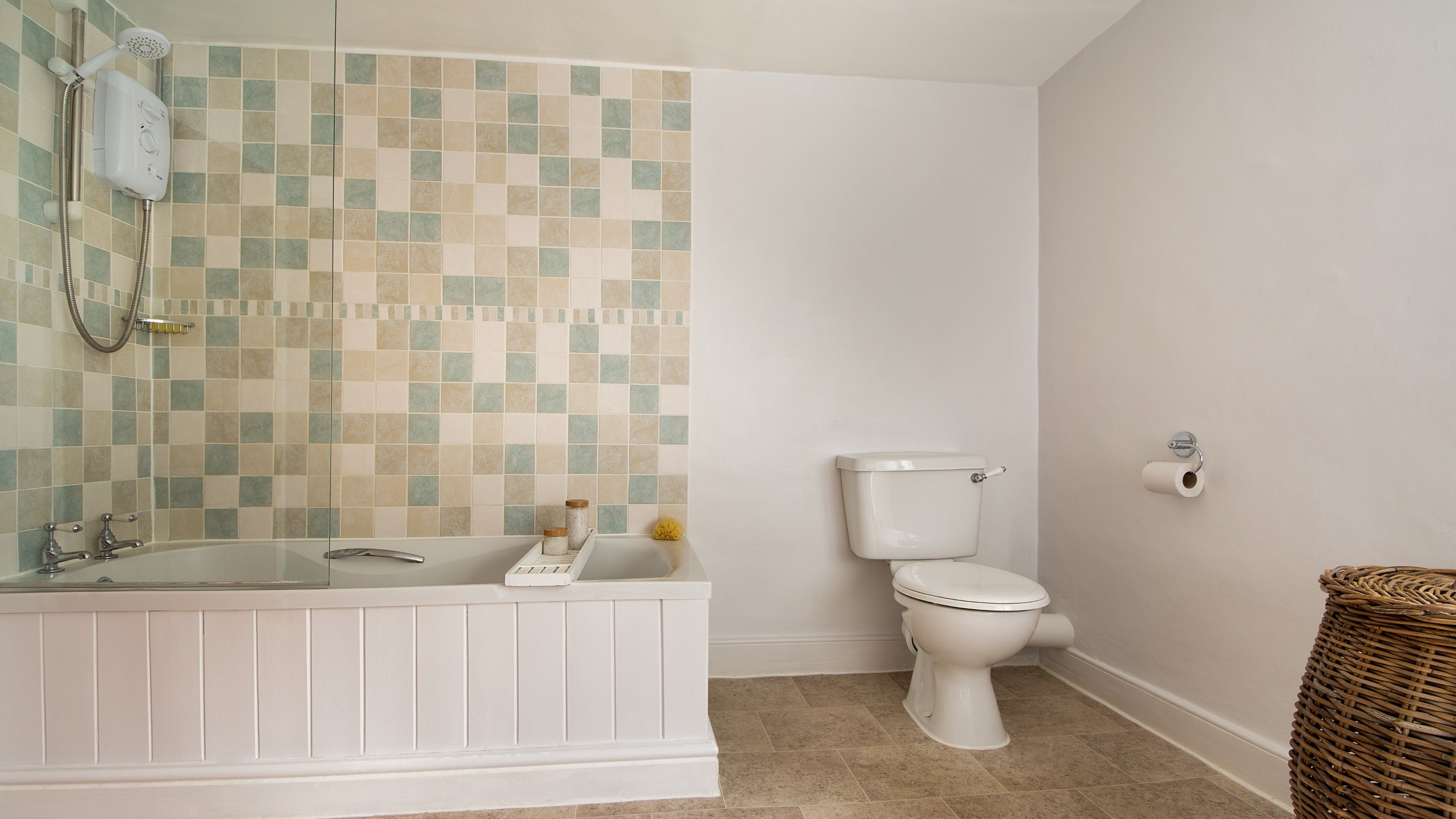 The bathroom, with shower over bath, at Bridge Farm Cottage, Suffolk