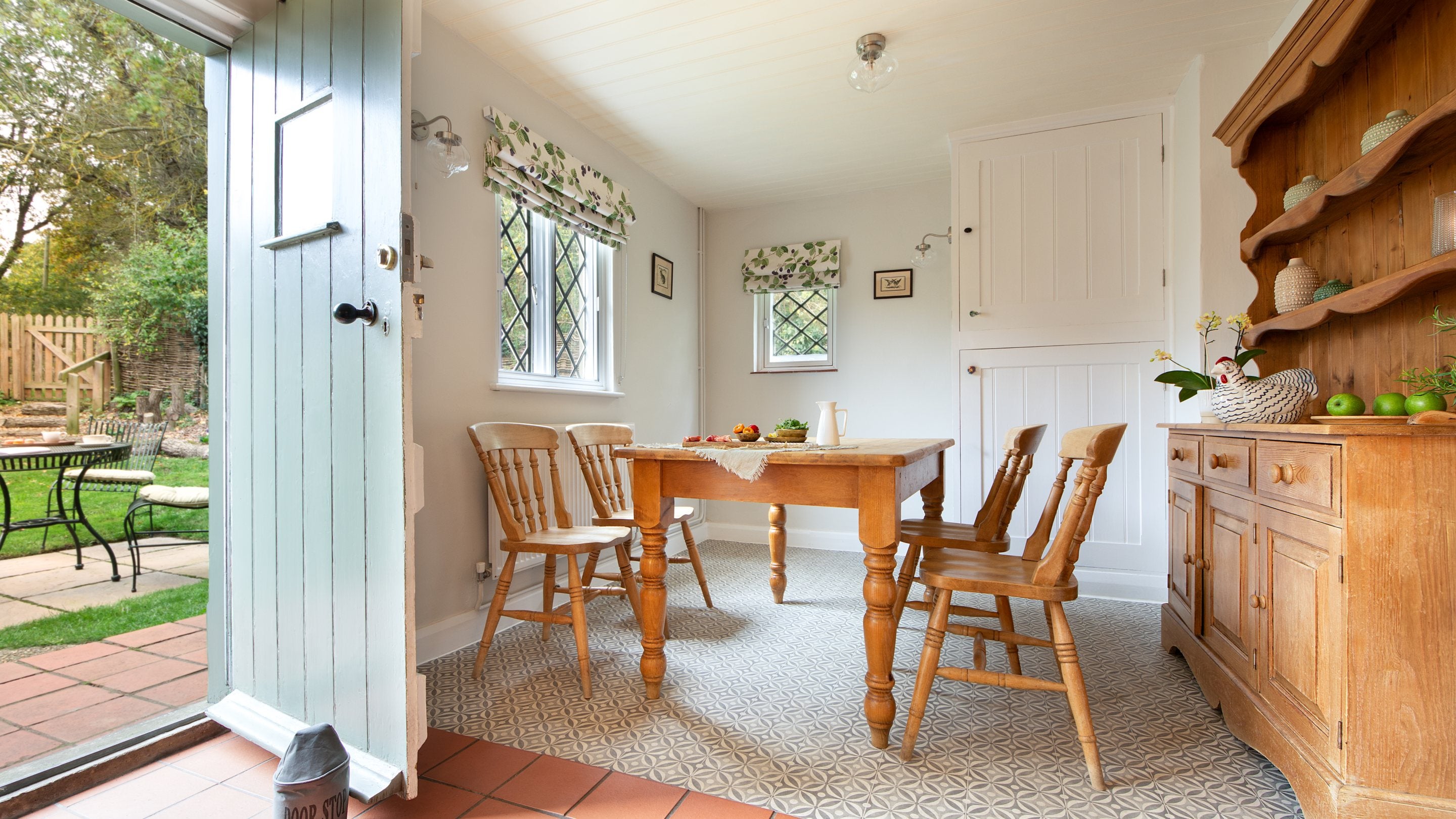 The dining table in the open-plan kitchen and dining room at Bridge Farm Cottage, Suffolk