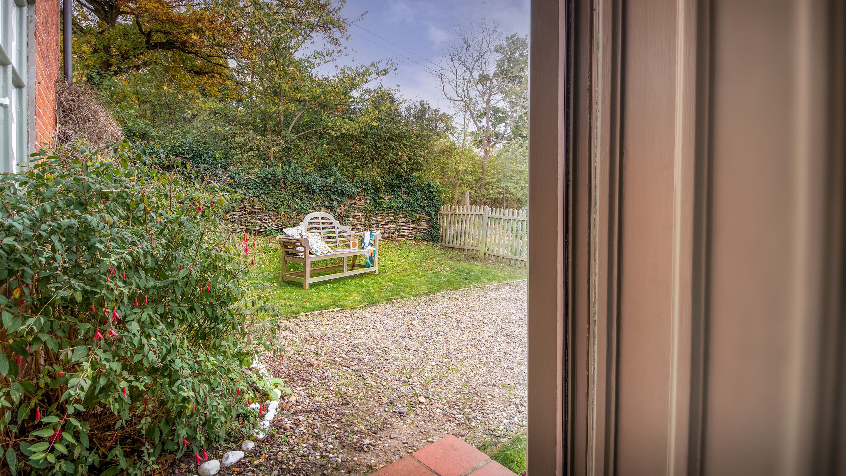 Looking into the front garden of Bridge Farm Cottage from the front door, Suffolk