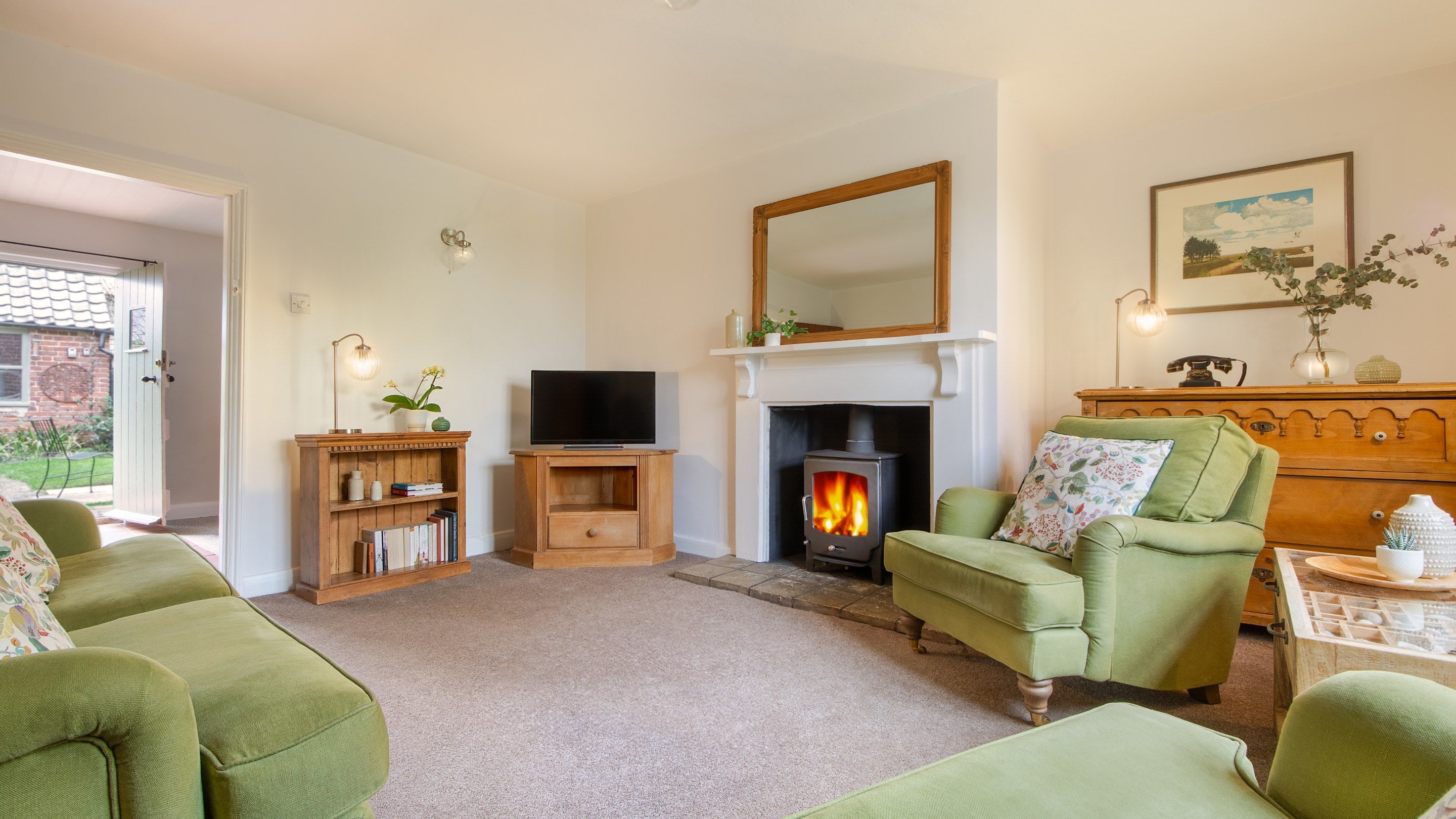 The sitting room at Bridge Farm Cottage, which leads into the open-plan kitchen and dining room, Suffolk