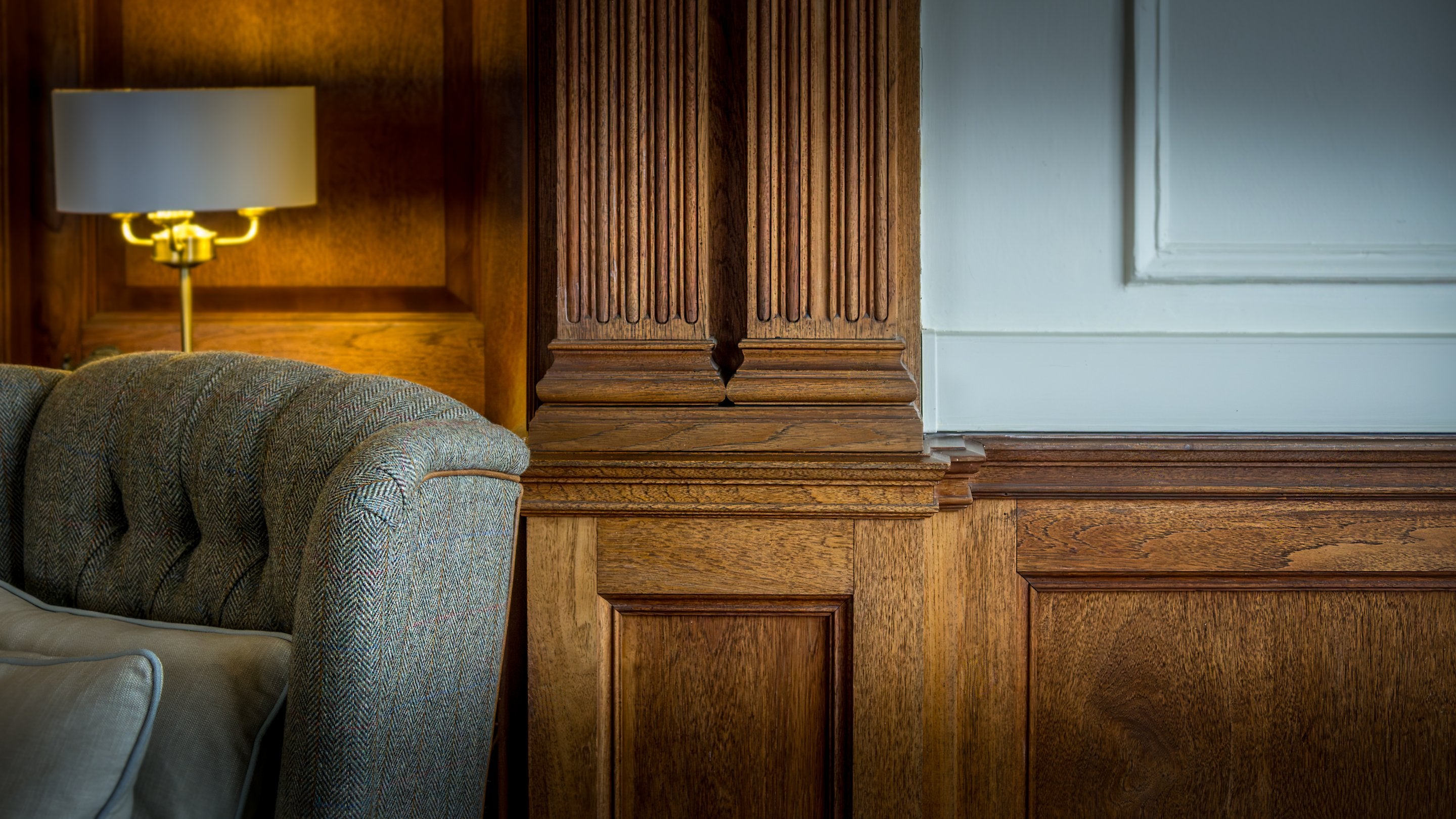 The period wood panelling in the sitting and dining room at Deben View, Suffolk