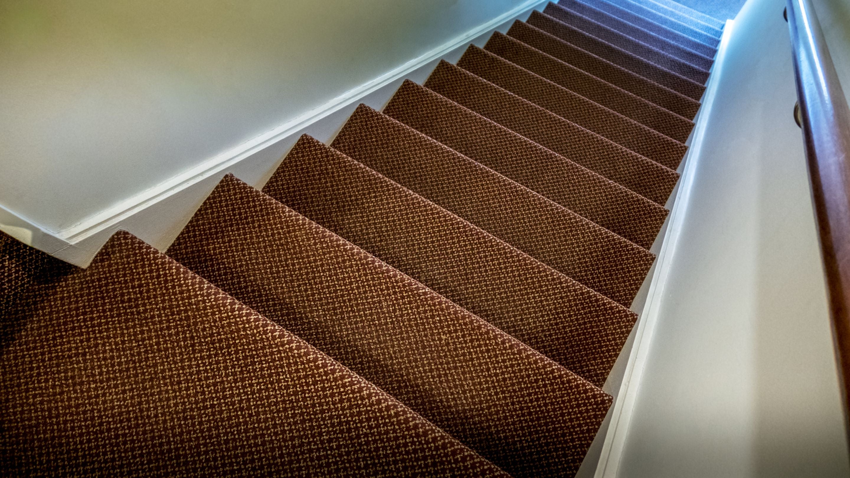 The shared staircase that leads to the second-floor holiday apartments in Tranmer House, Kyson and Wilford, Suffolk