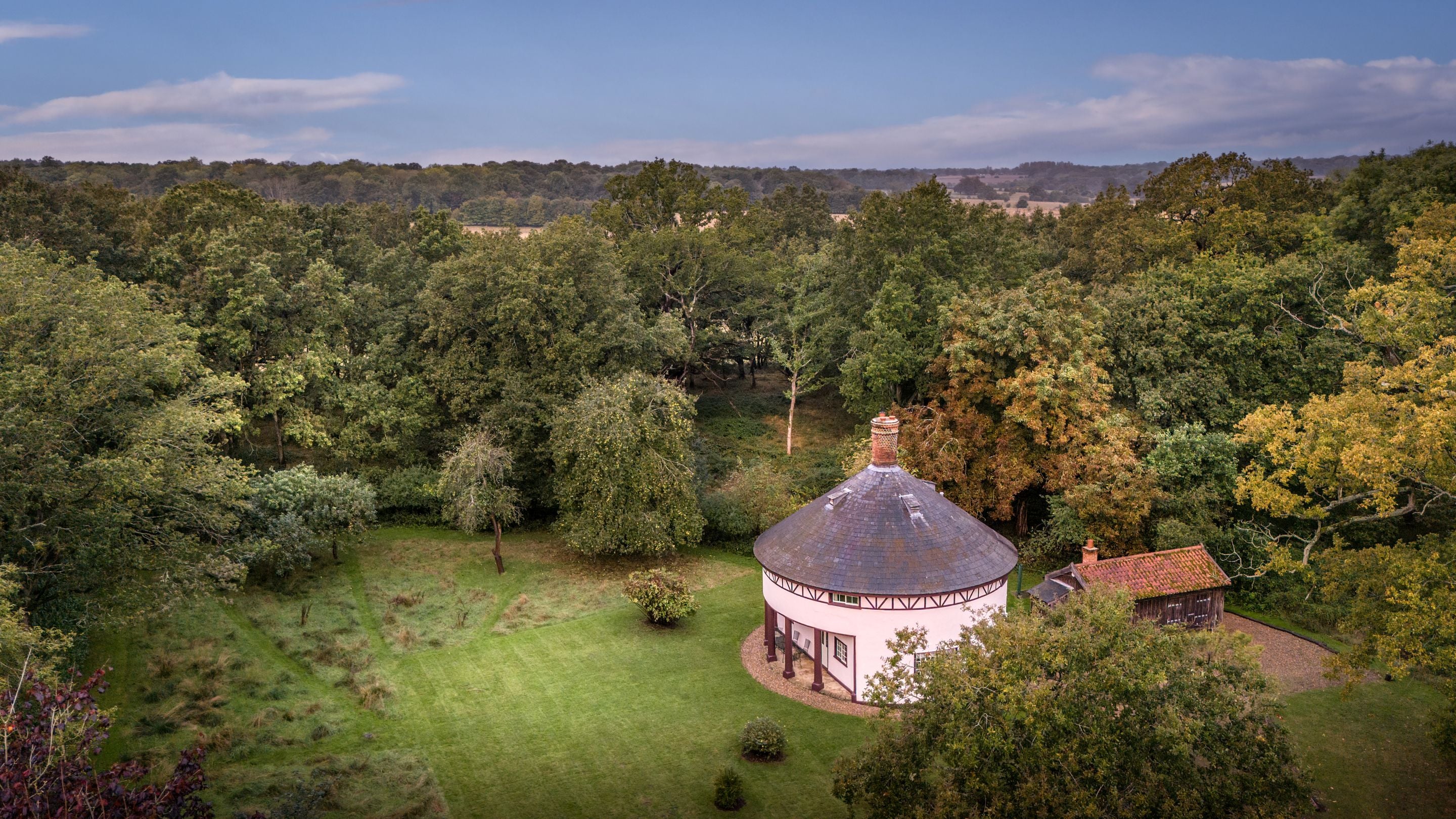 An aerial view of The Round House and its garden, in a woodland glade on the Ickworth Estate, Suffolk