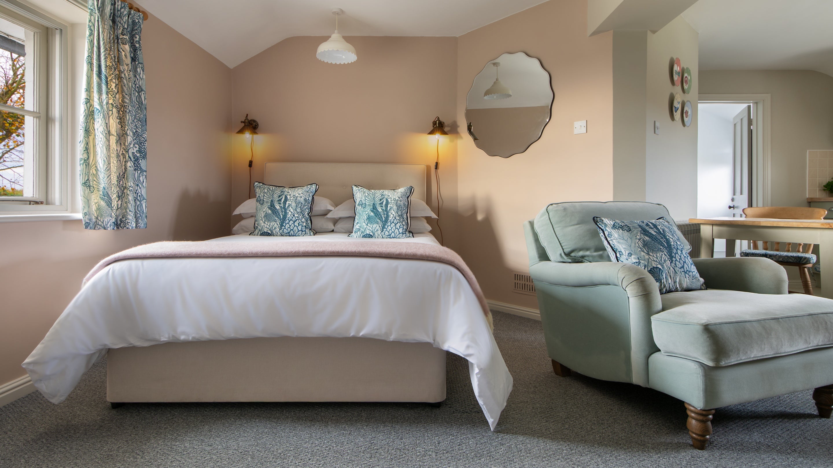The bedroom and seating area at Stonechat, Suffolk