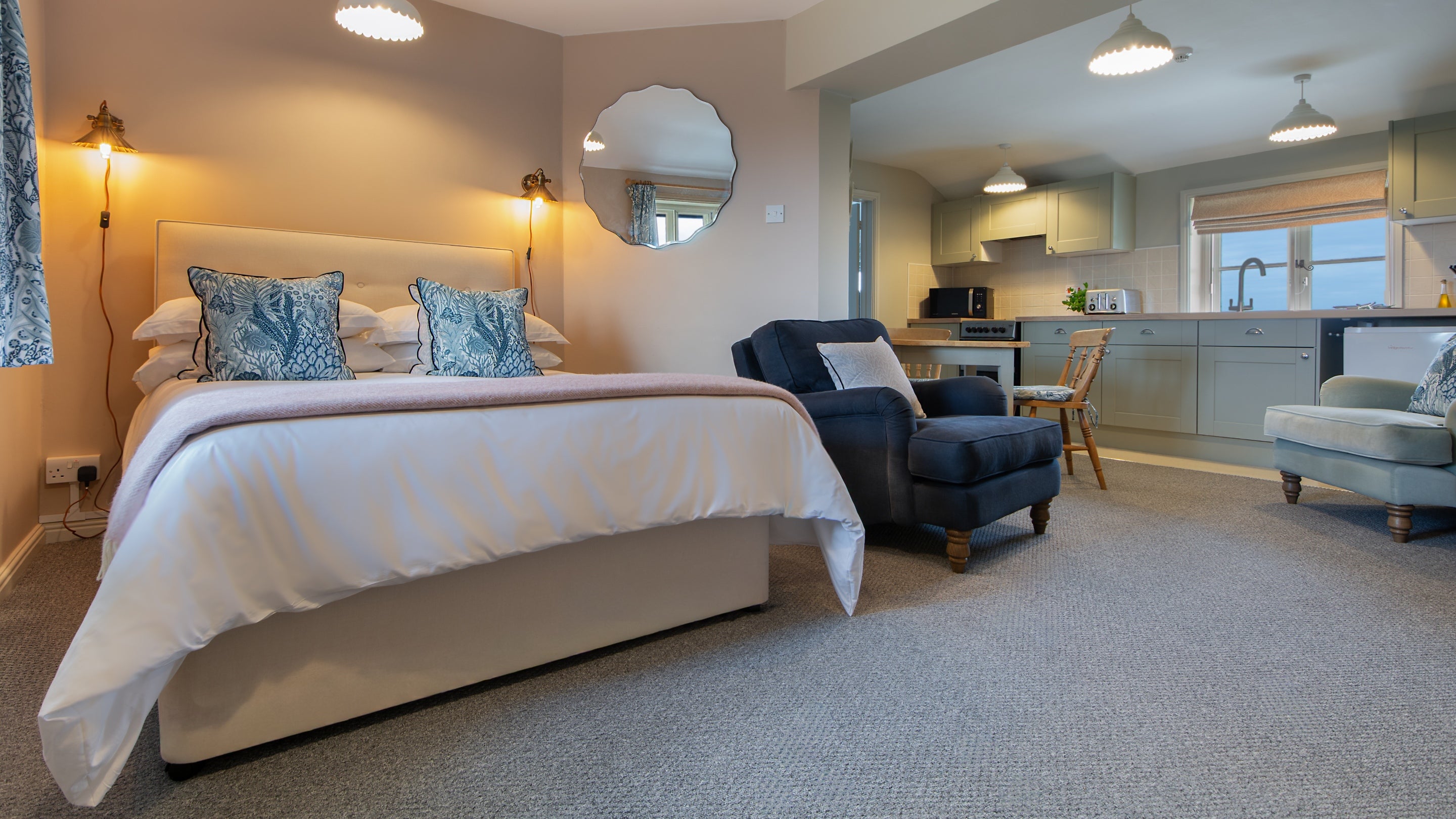 The open plan bedroom, seating and kitchen area at Stonechat, Suffolk