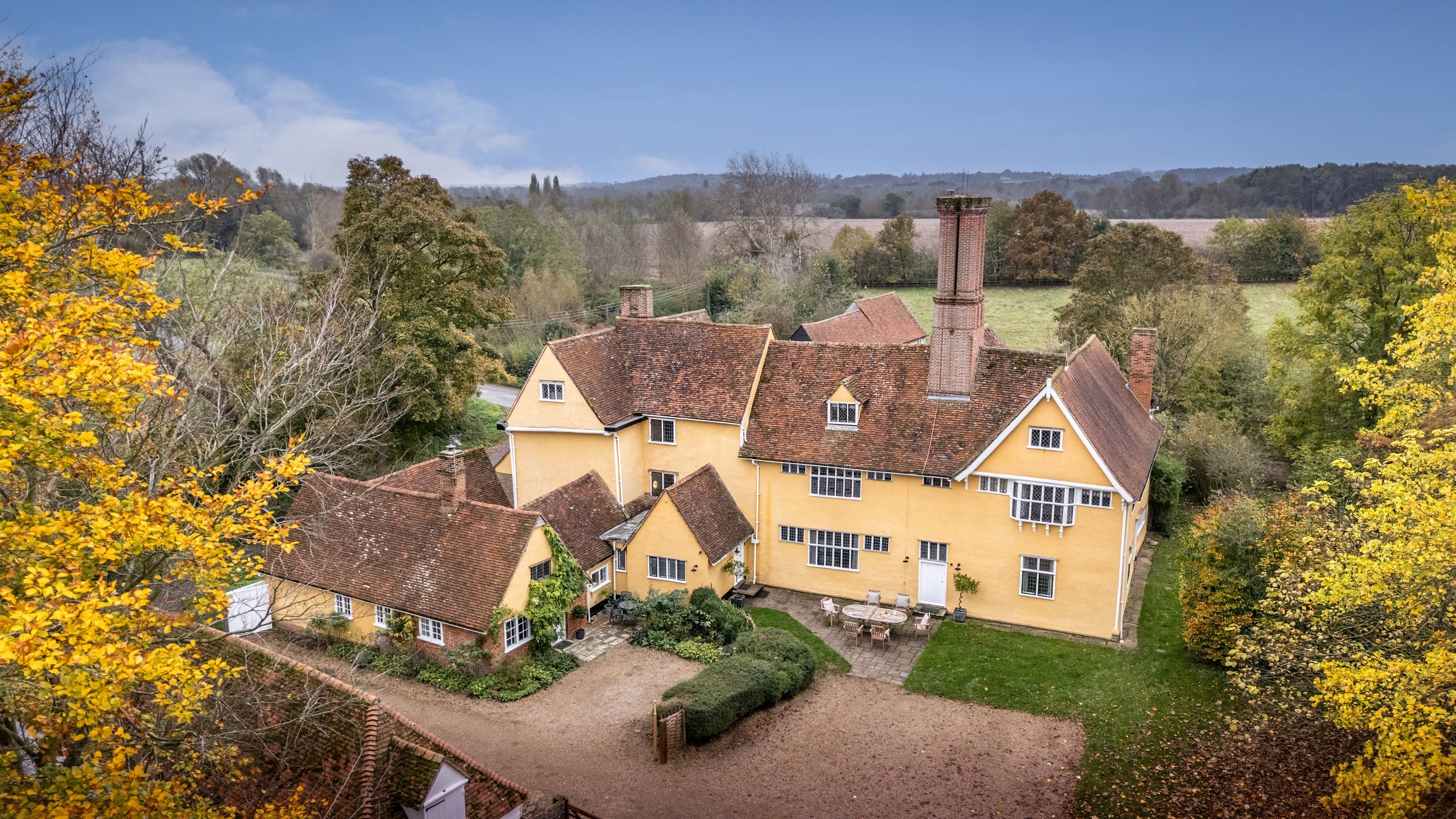 An aerial view of Thorington Hall on the right and Thorington Lodge on the left, Suffolk