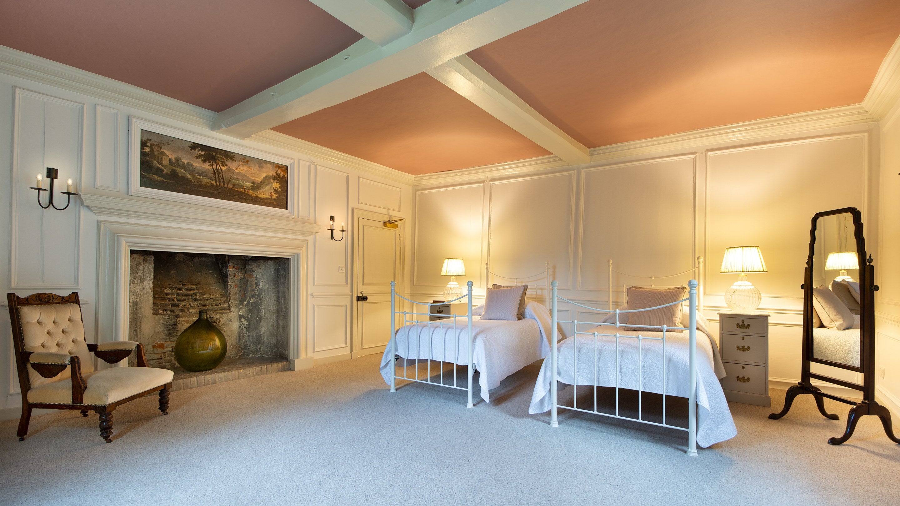 Bedroom 8 'Penrose,' with twin beds, on the ground floor of Thorington Hall, Suffolk